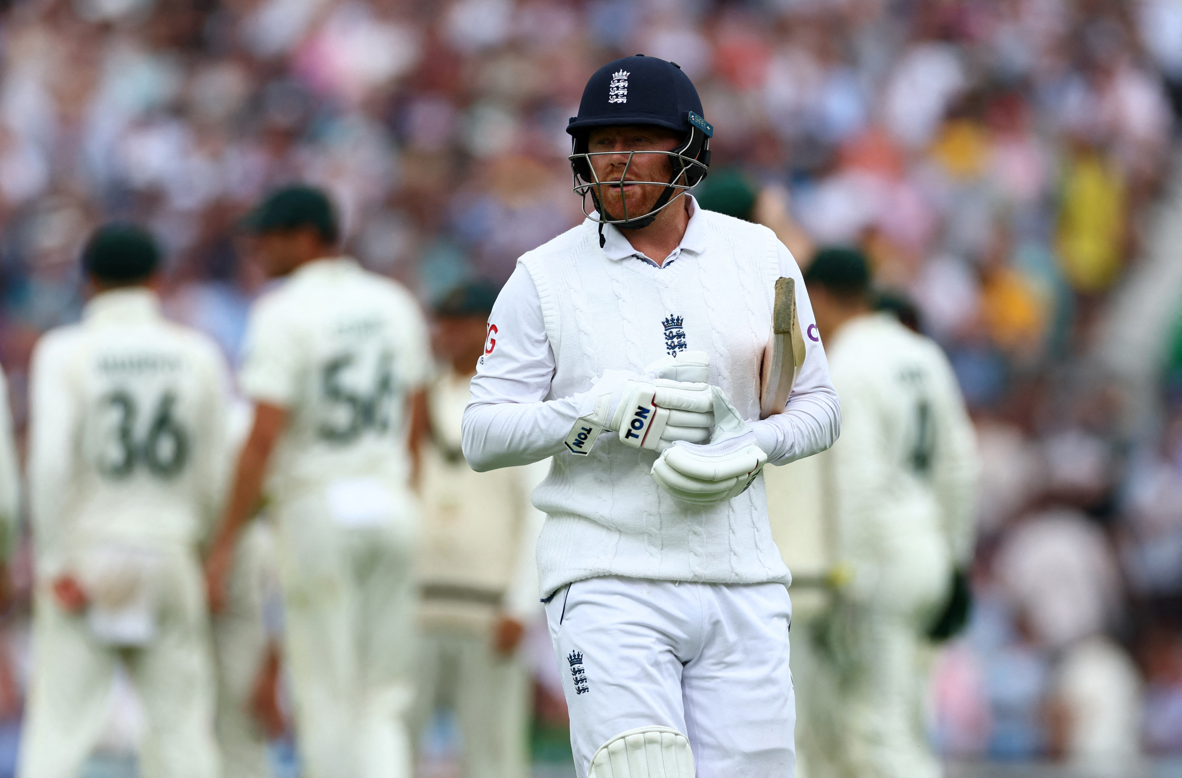 England's Jonny Bairstow walks after being bowled by Australia's Josh Hazlewood.