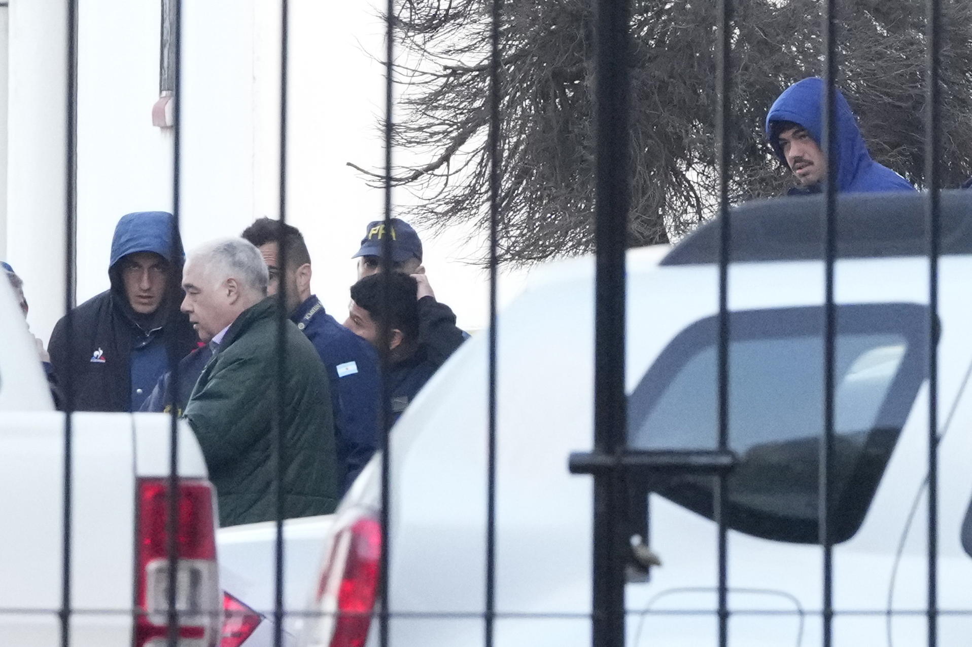 Police escort French rugby players Oscar Jegou and Hugo Auradou in Buenos Aires.