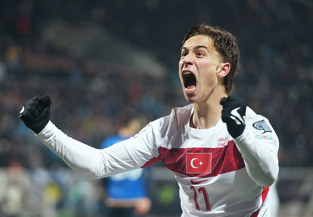 Kenan Yildiz of Turkiye celebrates his team's first goal scored by teammate Kerem Aktuerkoglu.