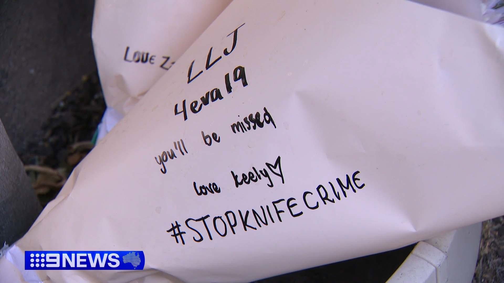 A 19-year-old man is in custody after a teenager, also 19, was killed in an alleged stabbing in Melbourne this morning.﻿Two bouquets of flowers were left in the middle of King Street, metres from the crime scene, with the words: "Long Live Jojo, forever 19, you'll be missed."