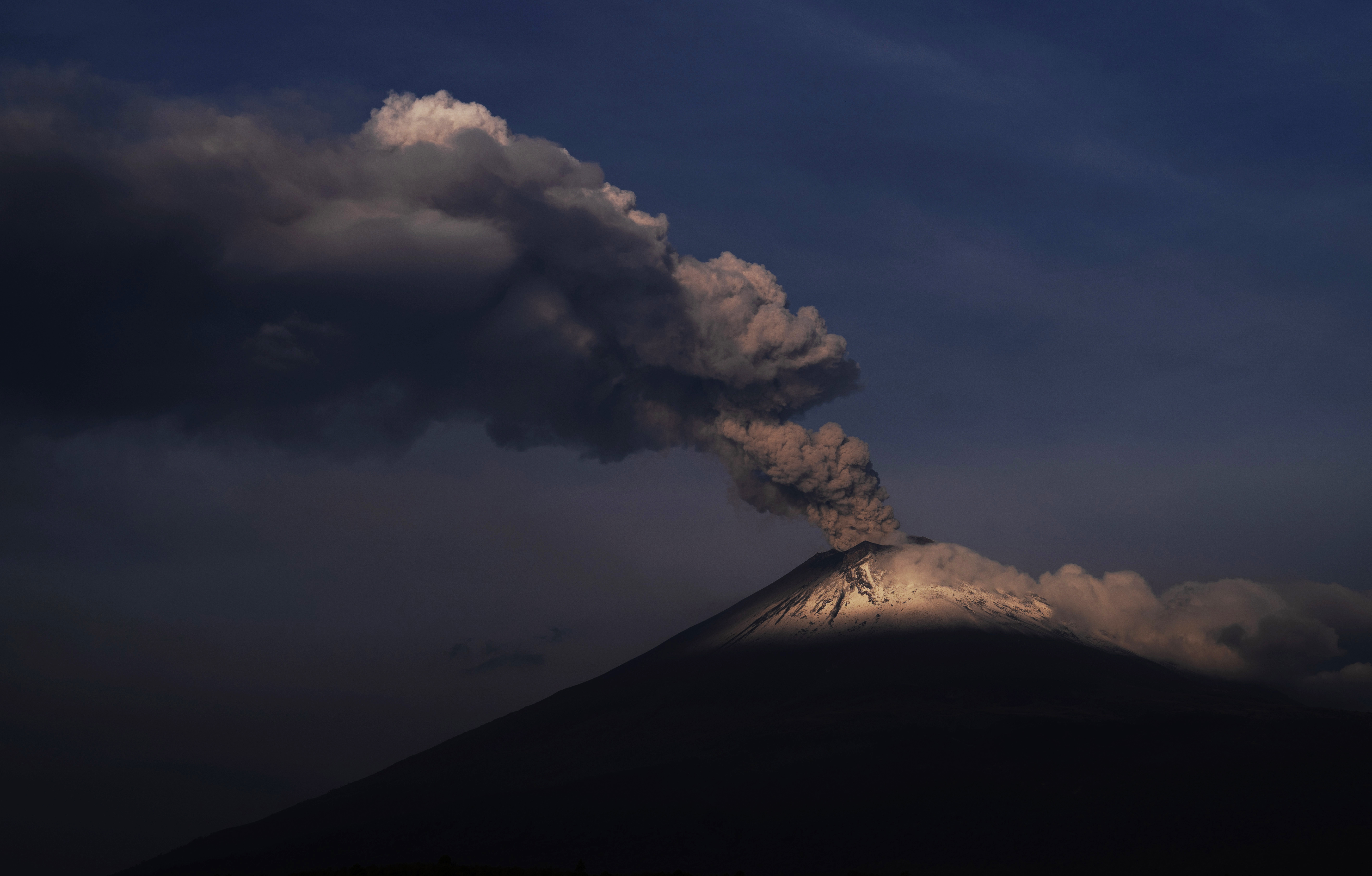 The Popocatepetl volcano spews ash and steam, seen from Santiago Xalitzintla, Mexico, Wednesday, May 24, 2023 