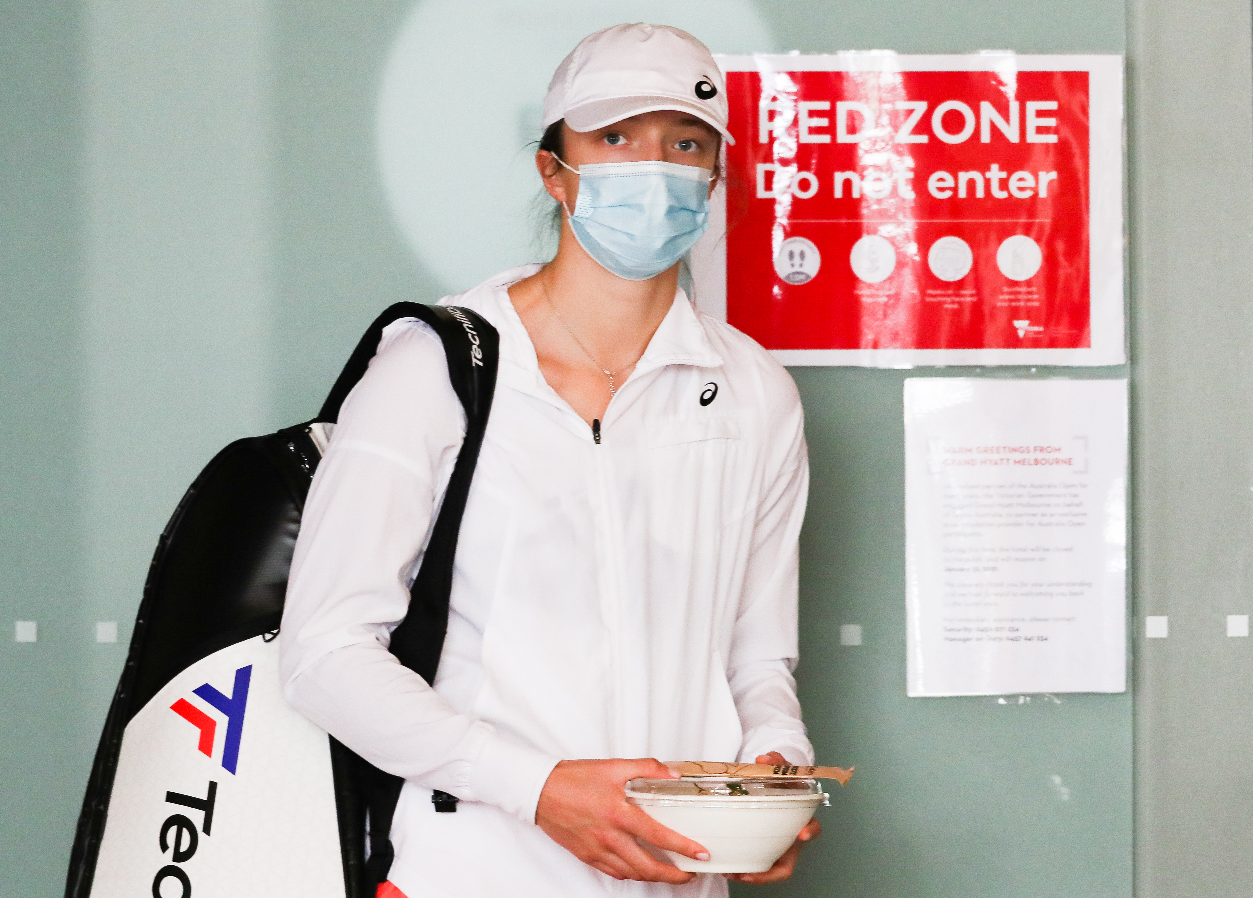 A tennis player is seen awaiting transport at the Grand Hyatt Melbourne Hotel.