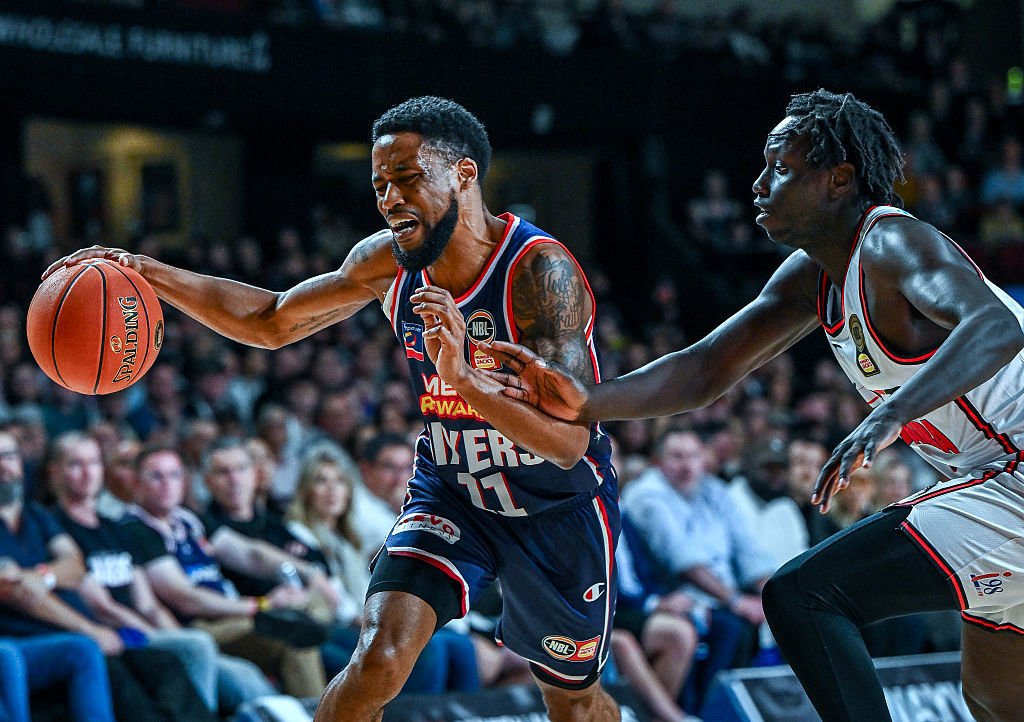 Bryce Cotton (L) and Wani Swaka Lo Buluk (R) in action.