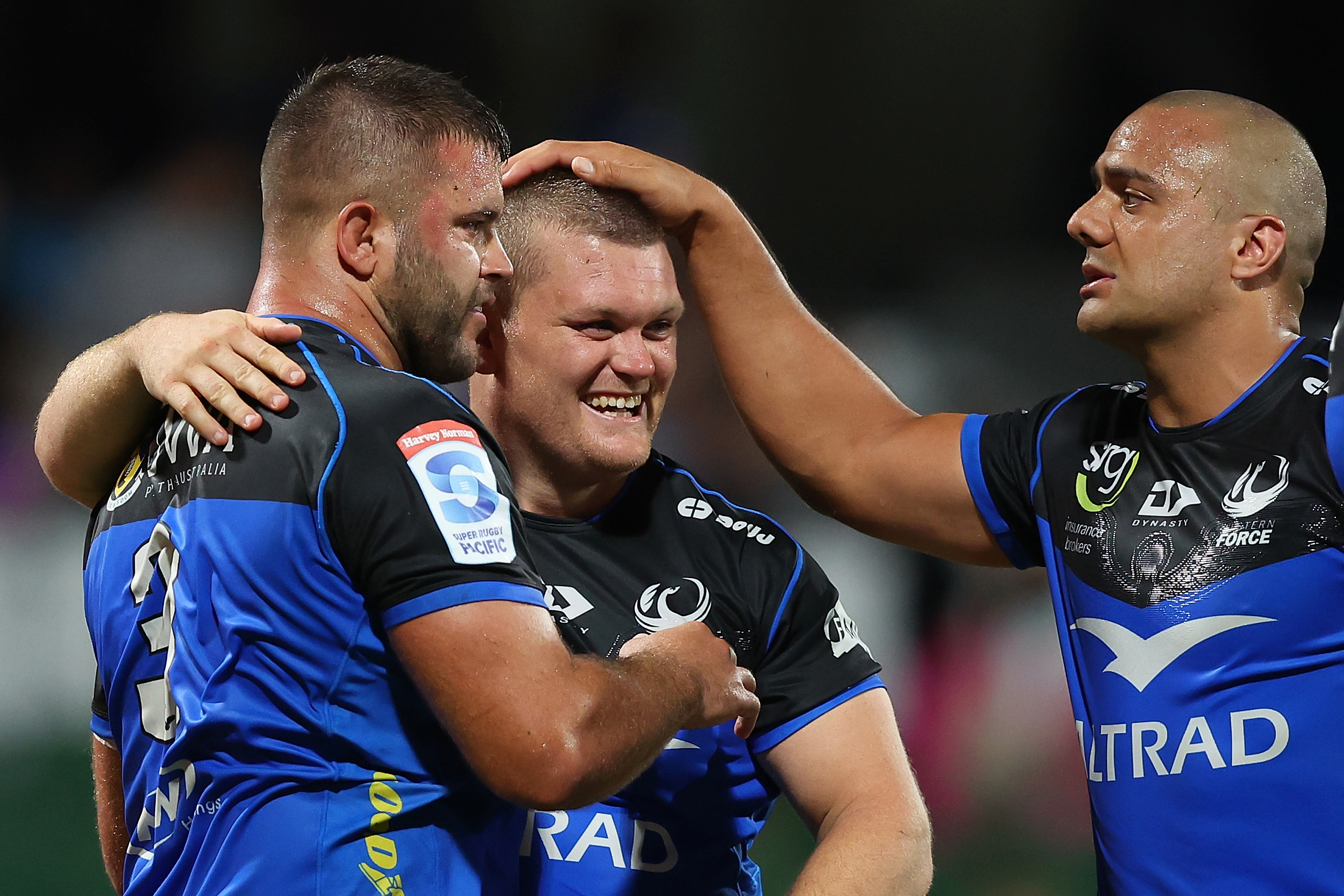 Santiago Medrano, Tom Robertson and Toni Pulu of the Force celebrate winning.