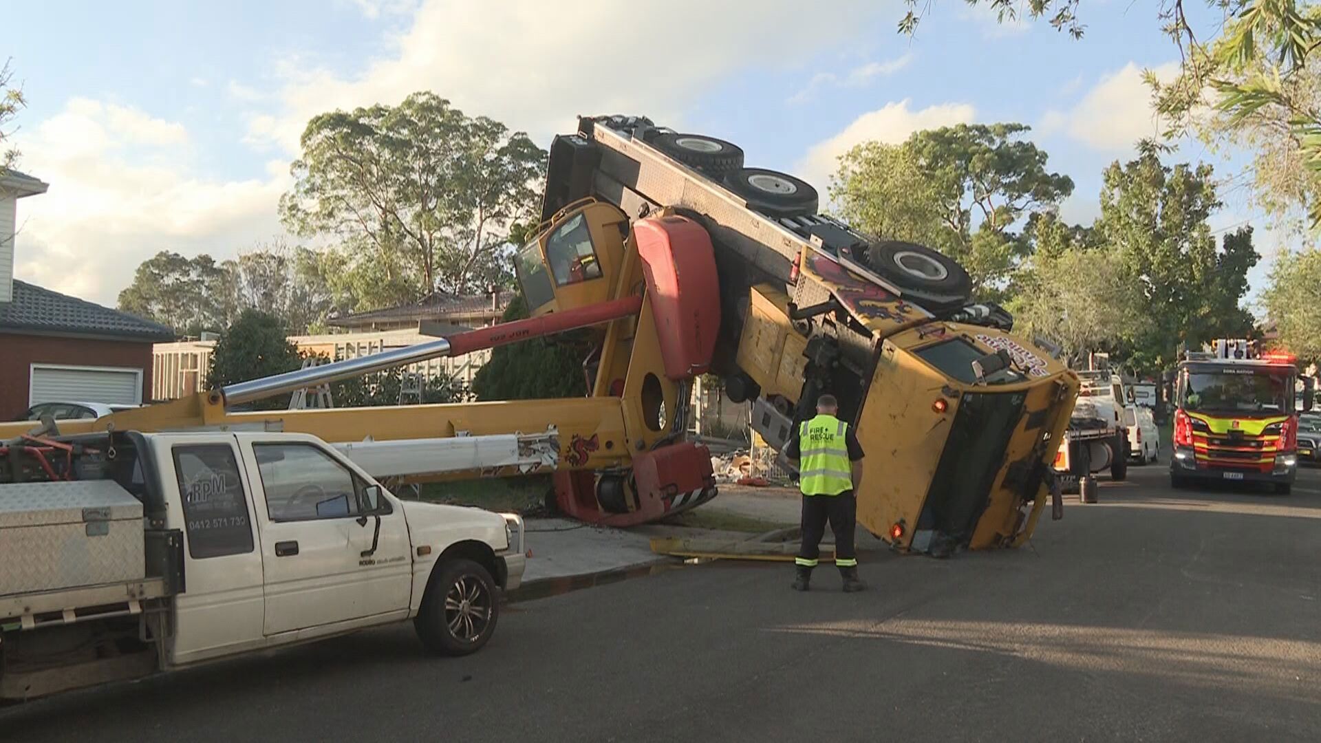 Crane flips on quiet Sydney street