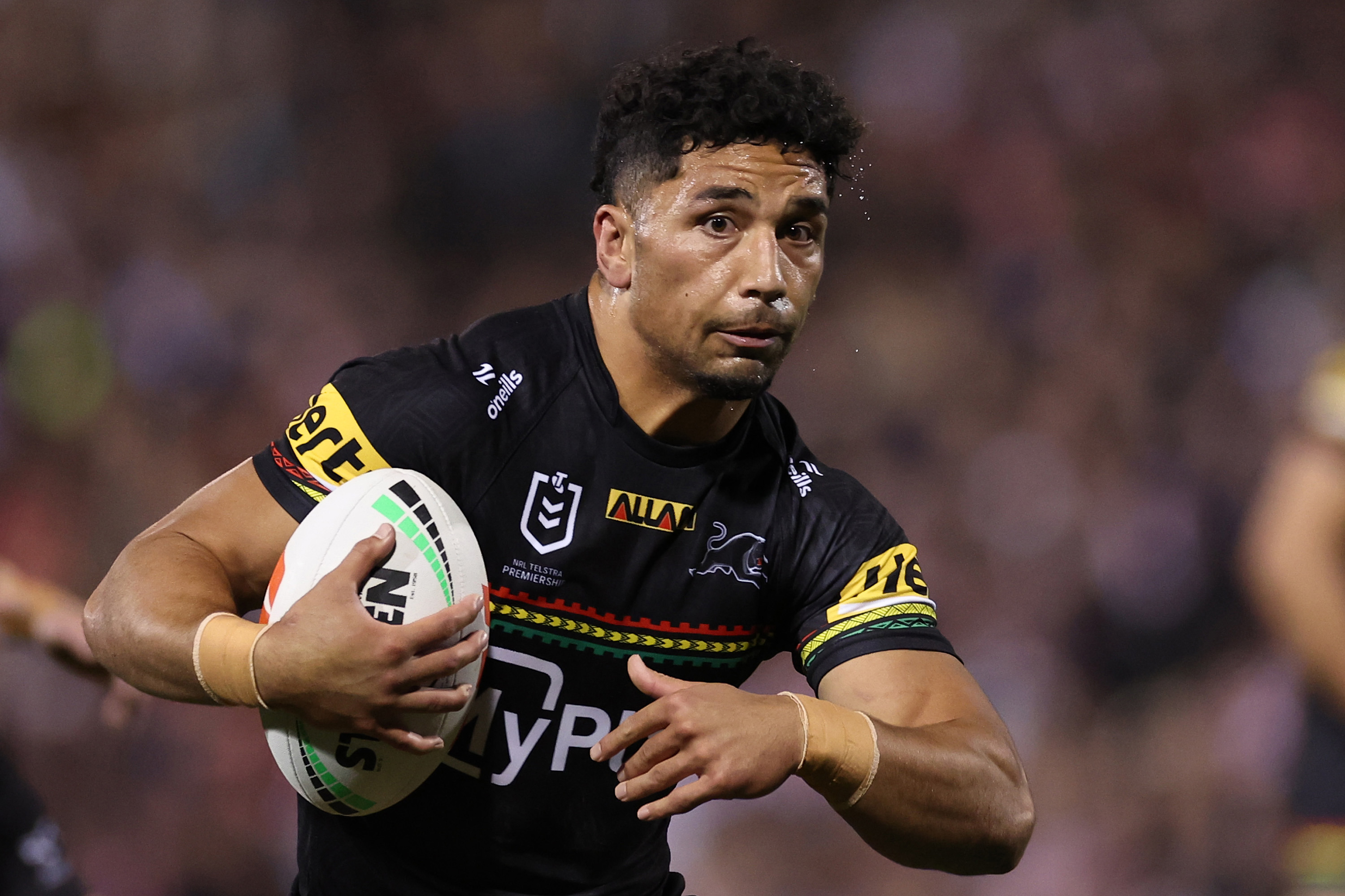 Izack Tago runs the ball during the NRL qualifying final match between Penrith Panthers and Sydney Roosters.