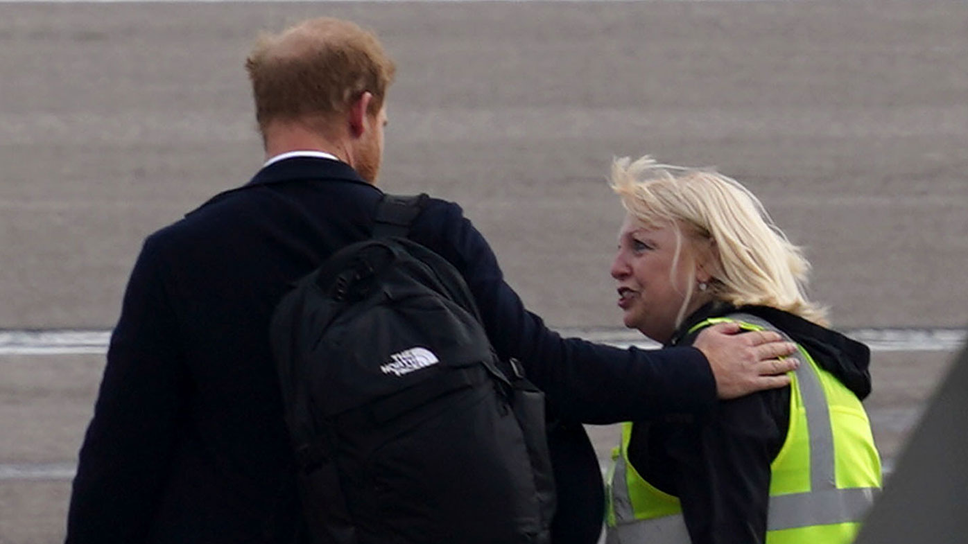 Prince Harry, Duke of Sussex boards a flight at Aberdeen Airport.