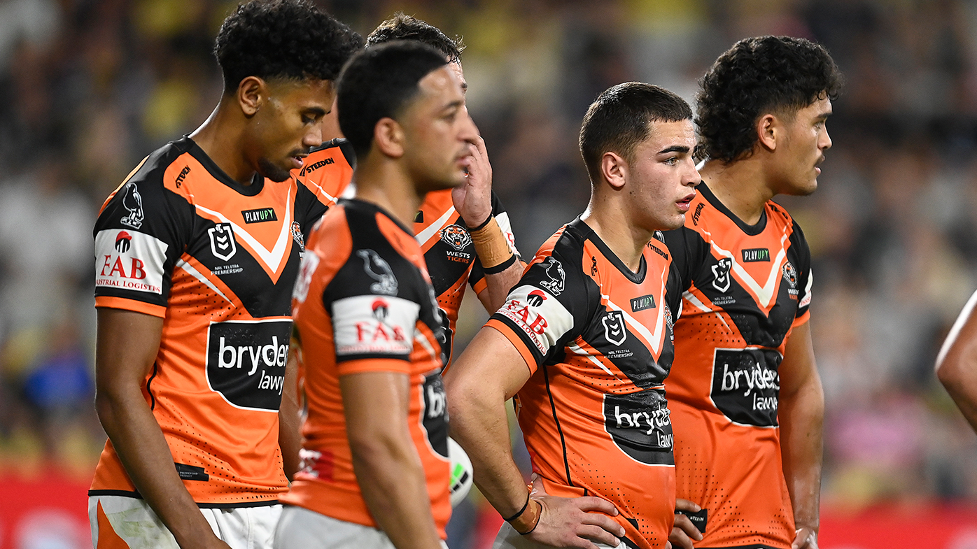The Tigers look on in despair, waiting for a conversion attempt during the round 18 NRL match between North Queensland Cowboys and Wests Tigers.