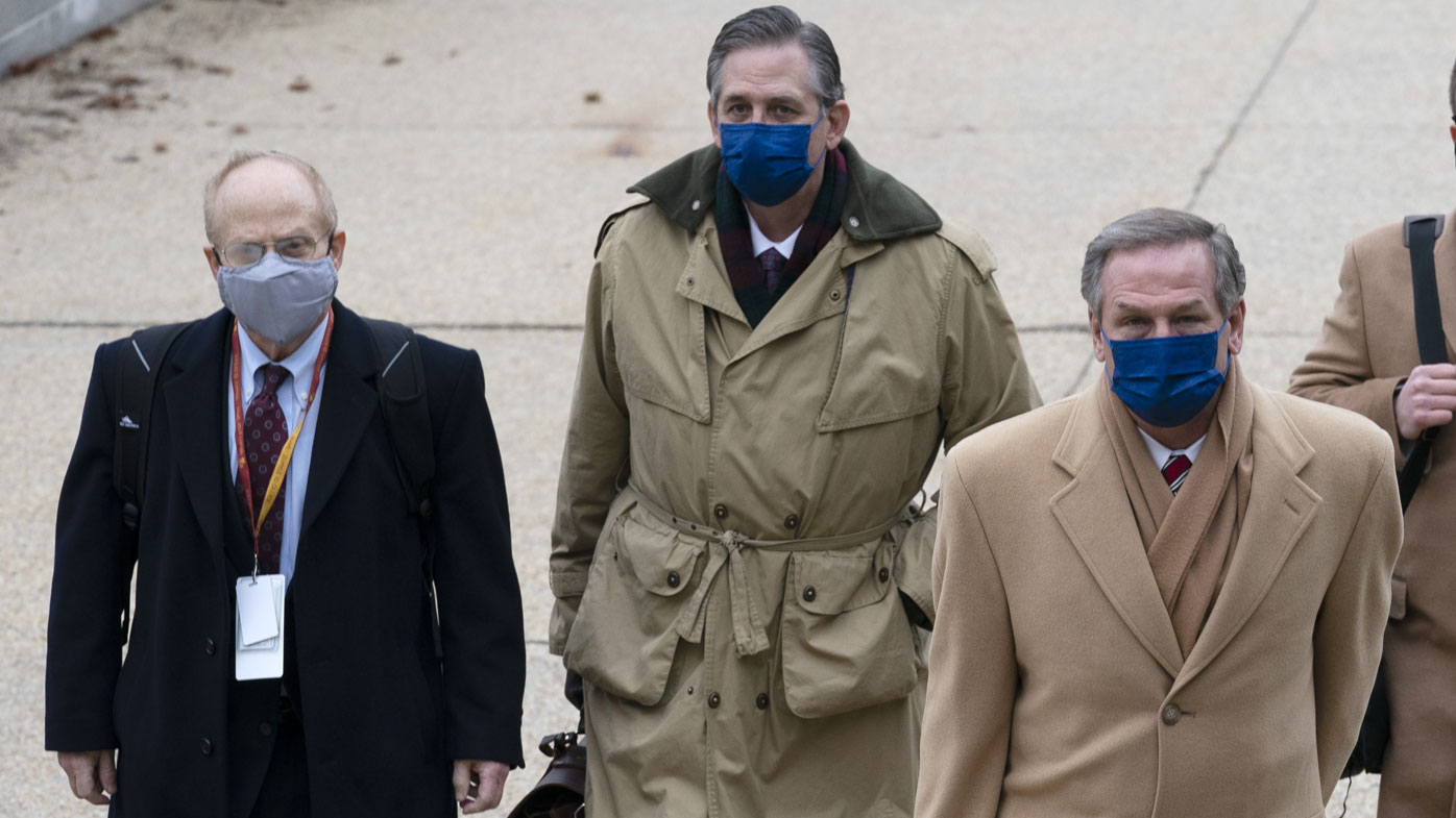 From left, David Schoen, Bruce Castor and Michael van der Veen, lawyers for former President Donald Trump, arrive at the Capitol on the third day of the second impeachment trial of Trump in the Senate, Thursday, Feb. 11, 2021, in Washington