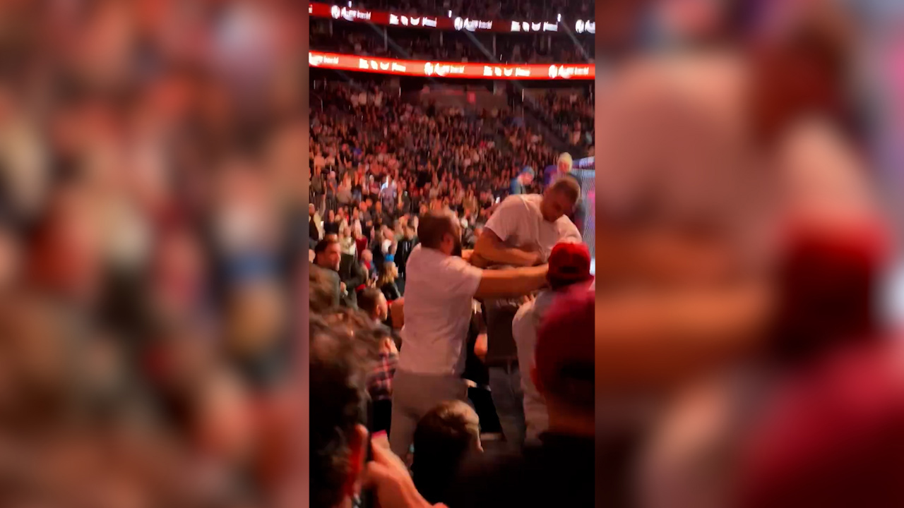 Sean Strickland and Dricus du Plessis come to blows in the crowd.