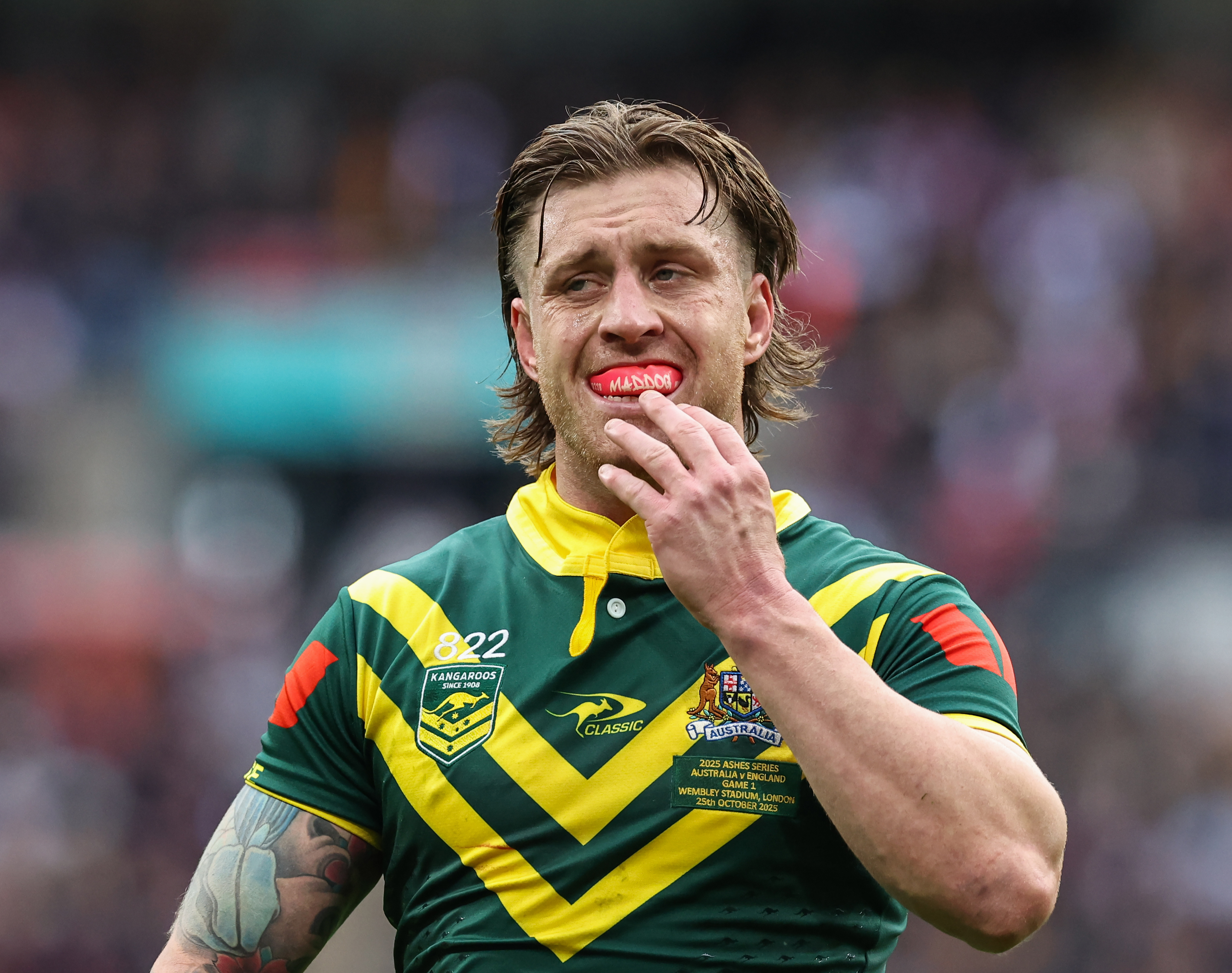 LONDON, ENGLAND - OCTOBER 25: Australia's Cameron Munster puts his mouth guard in during the Rugby League Ashes match between England and Australia at Wembley Stadium on October 25, 2025 in London, England. (Photo by Lee Parker - CameraSport via Getty Images)