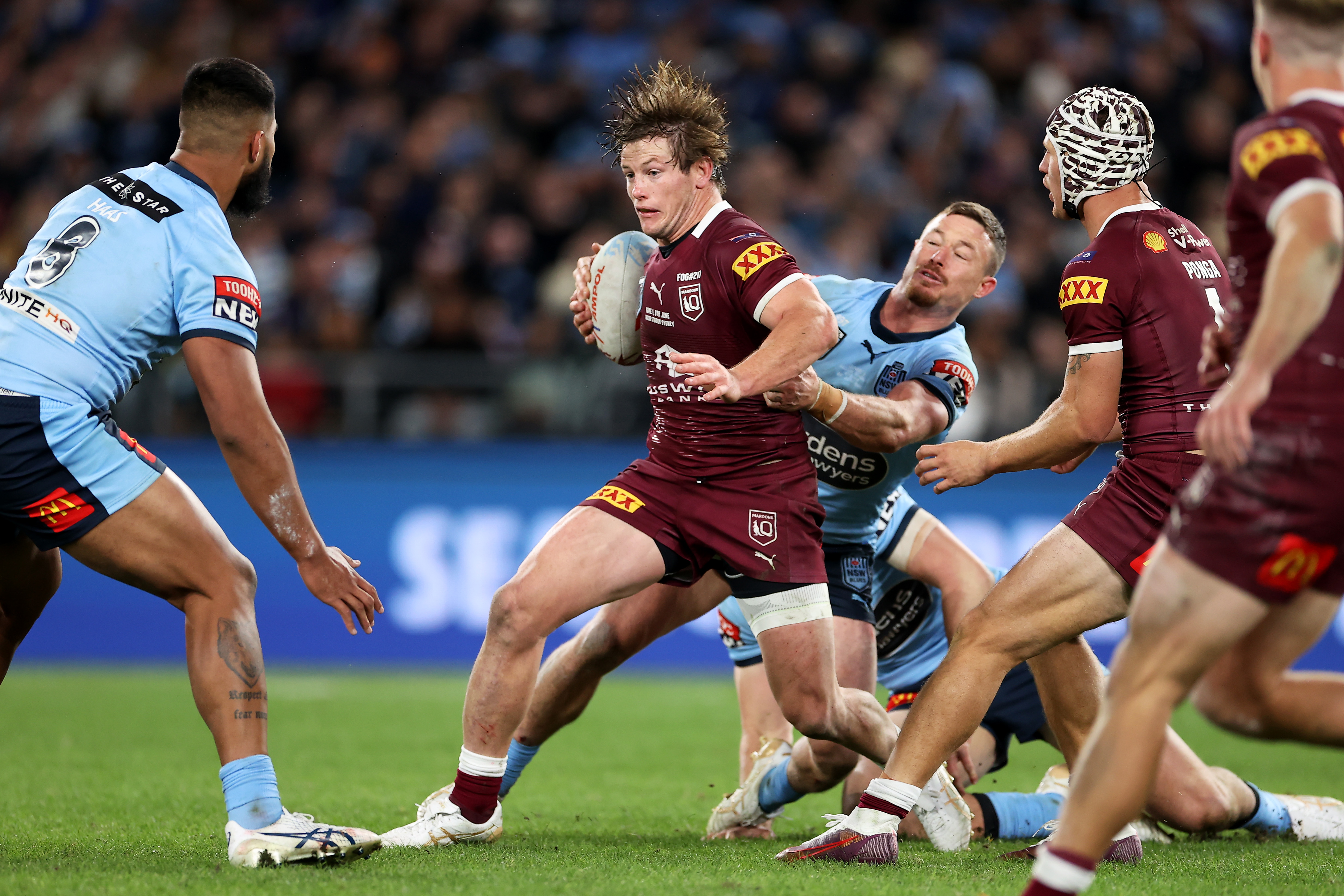 Harry Grant of the Maroons is tackled during game one of the 2022 State of Origin series between the New South Wales Blues and the Queensland Maroons at Accor Stadium on June 08, 2022, in Sydney, Australia. (Photo by Mark Kolbe/Getty Images)