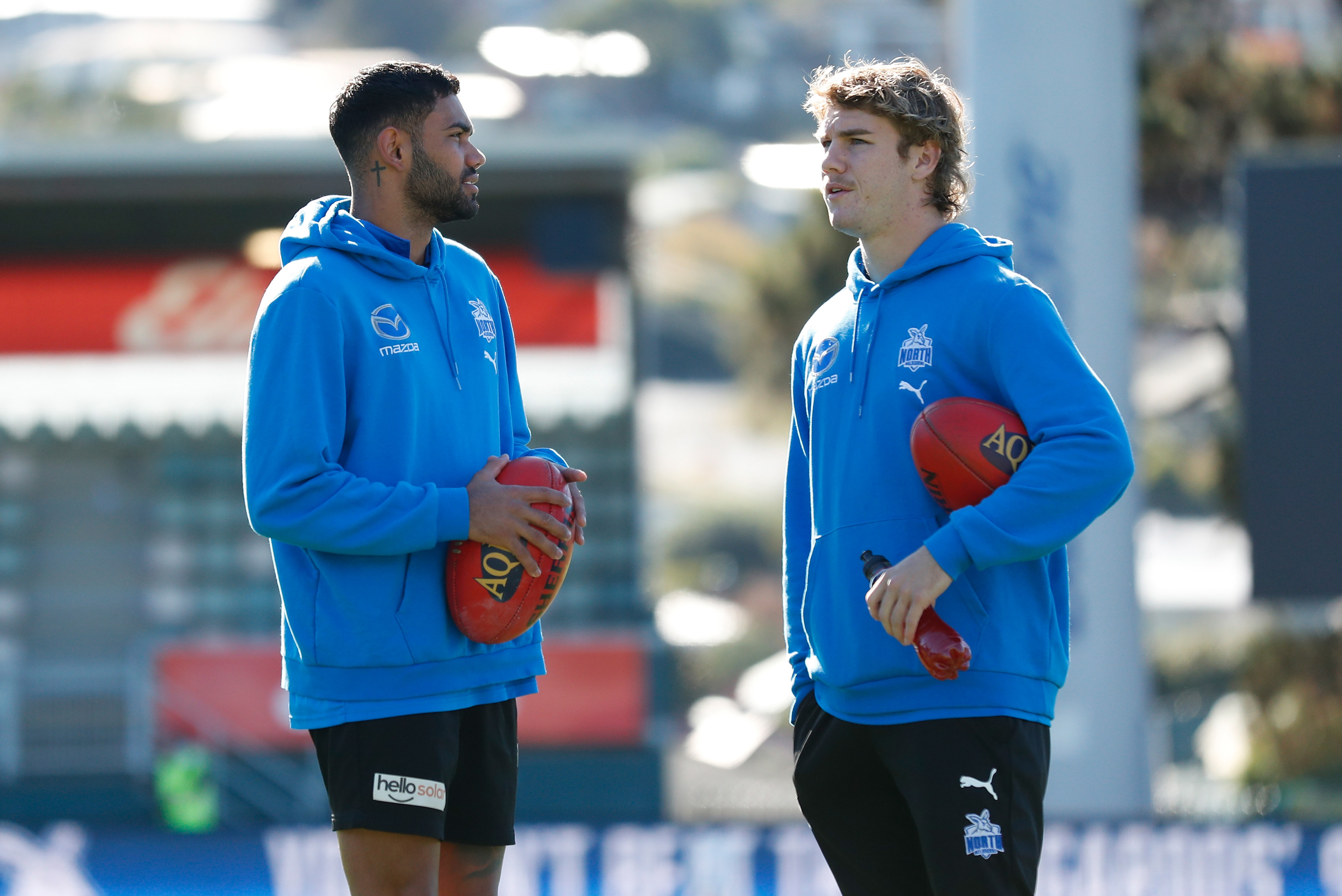 HOBART, AUSTRALIA - APRIL 24: Tarryn Thomas (left) and Jason Horne-Francis of the Kangaroos look on before the 2022 AFL Round 06 match between the North Melbourne Kangaroos and the Geelong Cats at Blundstone Arena on April 24, 2022 in Hobart, Australia. (Photo by Michael Willson/AFL Photos)
