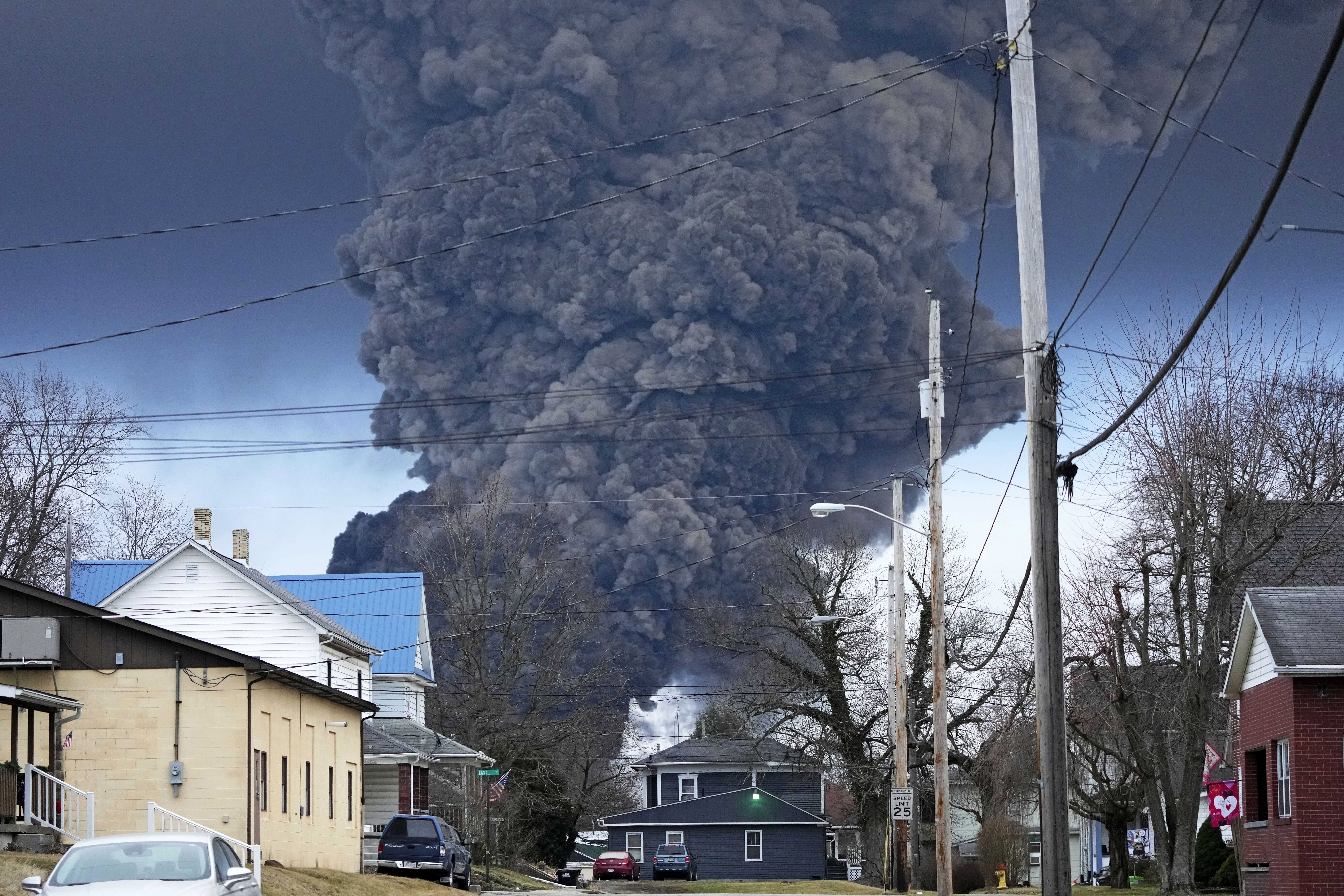 FILE - A black plume rises over East Palestine, Ohio, as a result of a controlled detonation of a portion of the derailed Norfolk Southern trains, Feb. 6, 2023. West Virginia's water utility says it's taking precautionary steps following the derailment of a train hauling chemicals that later sent up a toxic plume in Ohio. The utility said in a statement on Sunday, Feb. 16, 2023 that it has enhanced its treatment processes even though there hasnt been a change in raw water at its Ohio River intak