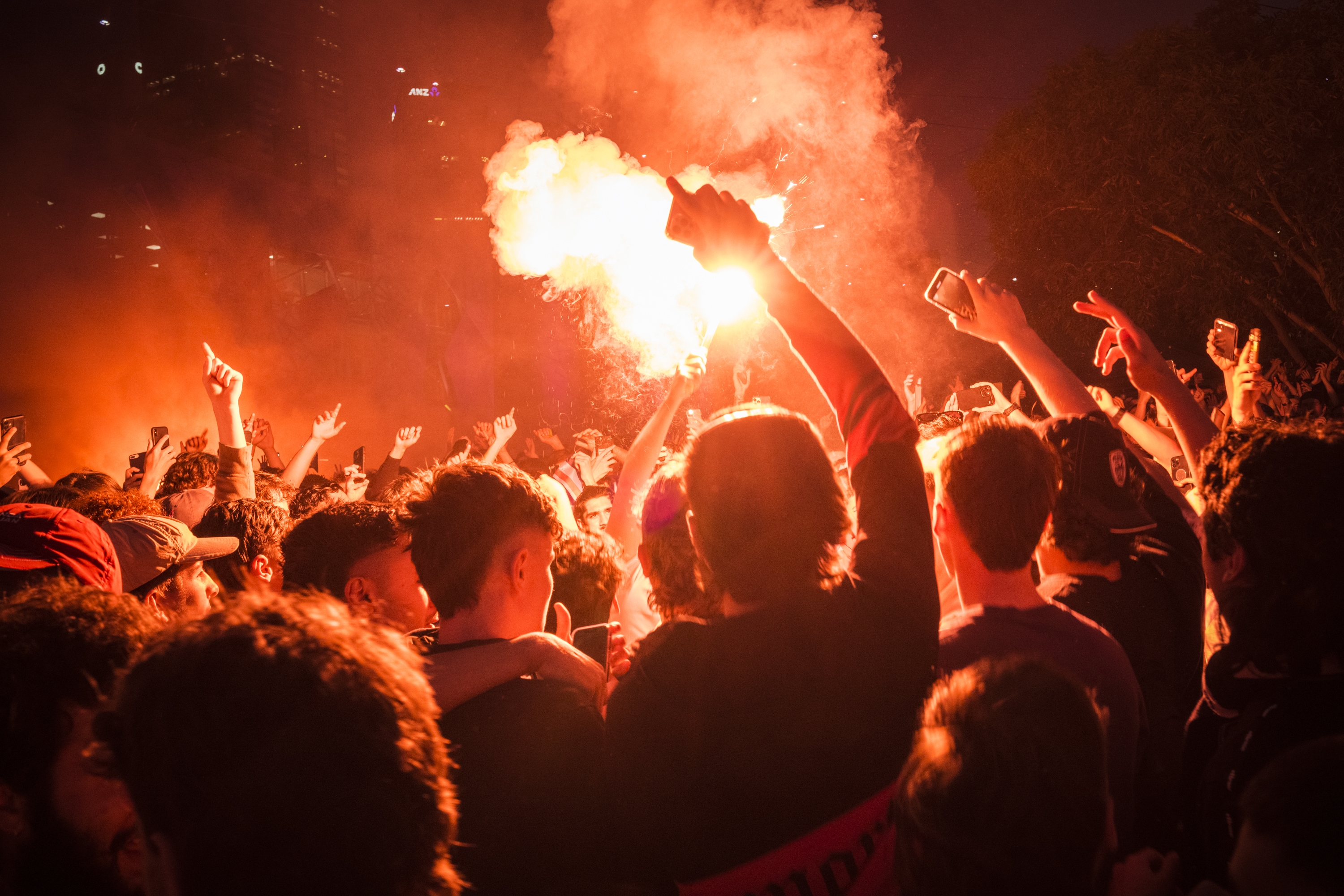 04/12/22 Soccer fans throw flares as they prepare to watch Australia take on Argentina in their knockout game in the 2022 World Cup, Federation Square, Melbourne. Photograph by Chris Hopkins