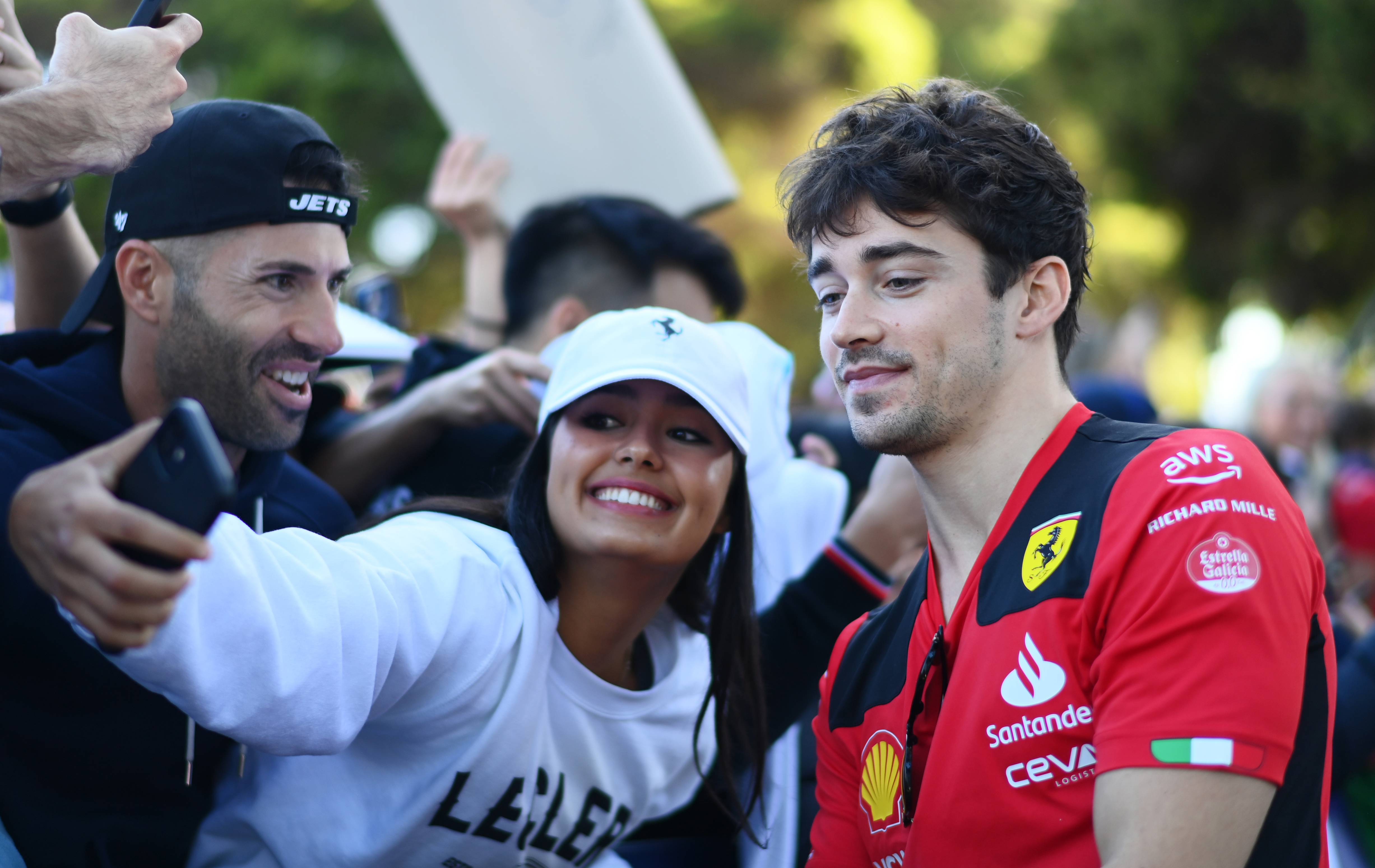 Charles Leclerc of Monaco and Ferrari greets fans on the Melbourne Walk.