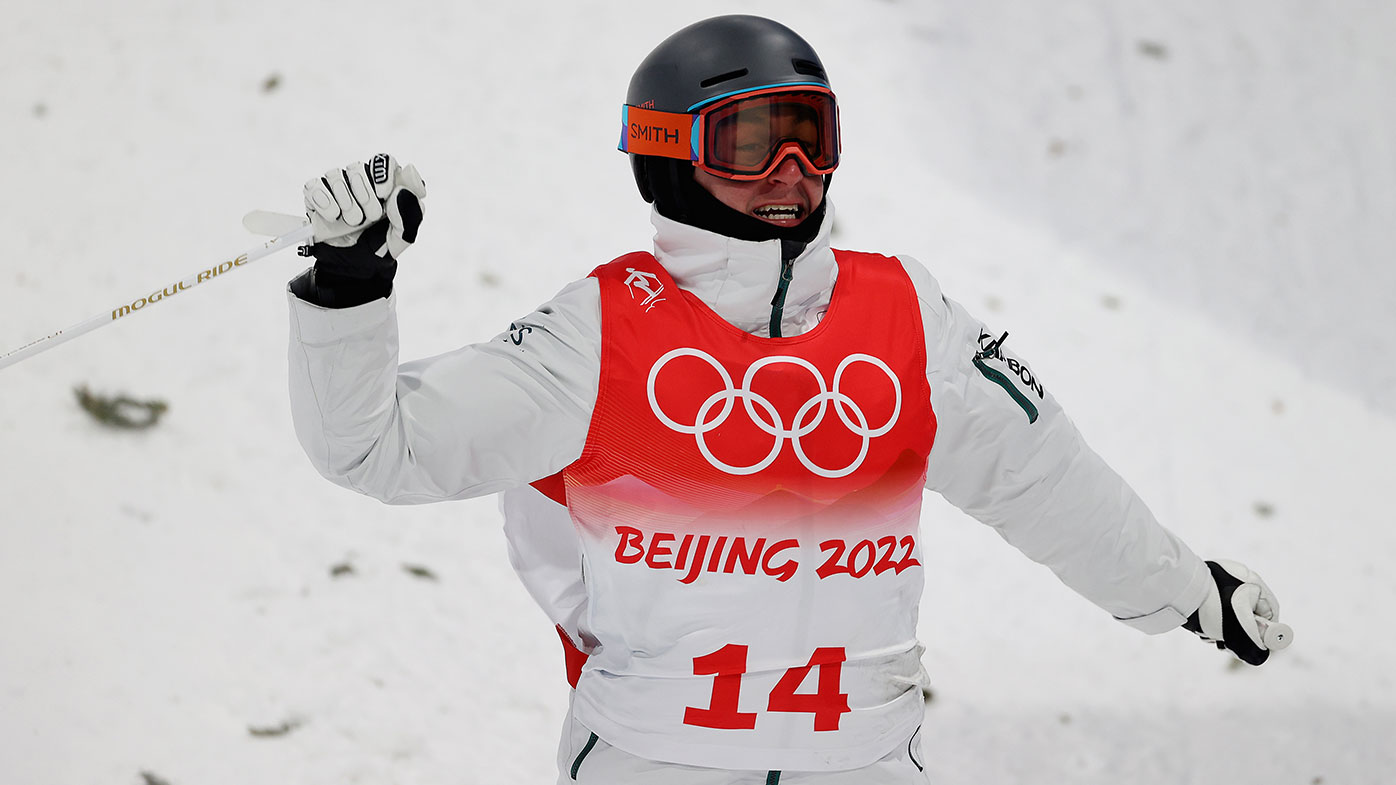 Cooper Woods of Team Australia reacts at the end of a run during the Men's Freestyle Skiing Moguls Final