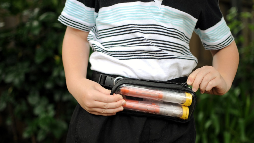 Boy wearing epipen pack