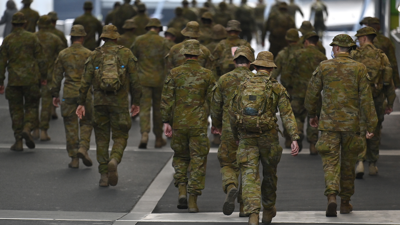 Members of the Australian Defence Force walk through the city on July 27, 2020 in Melbourne, Australia. Victoria has recorded 532 new cases of coronavirus and six more deaths.