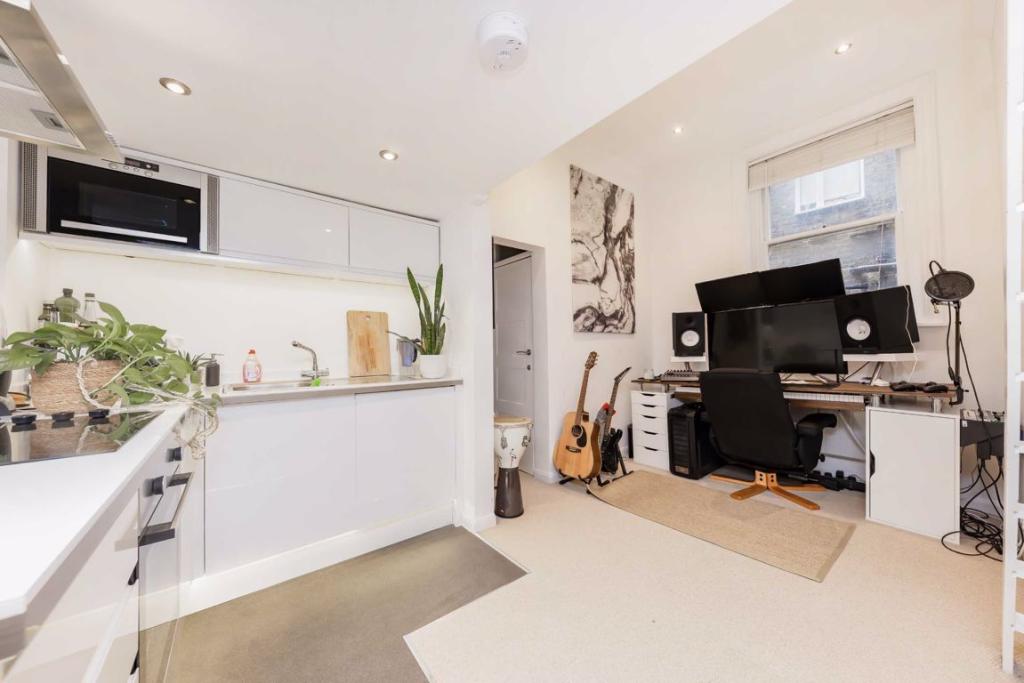 London studio flat is so small that you can't even stand up in the bedroom.