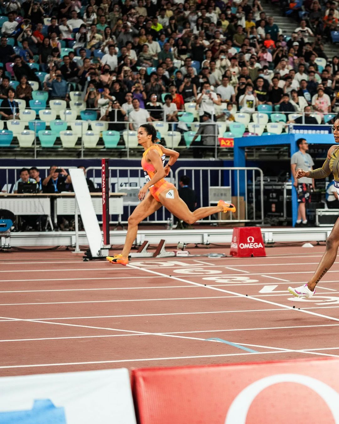 Torrie Lewis crosses the line to win the 200m event at the Xiamen Diamond League meet.