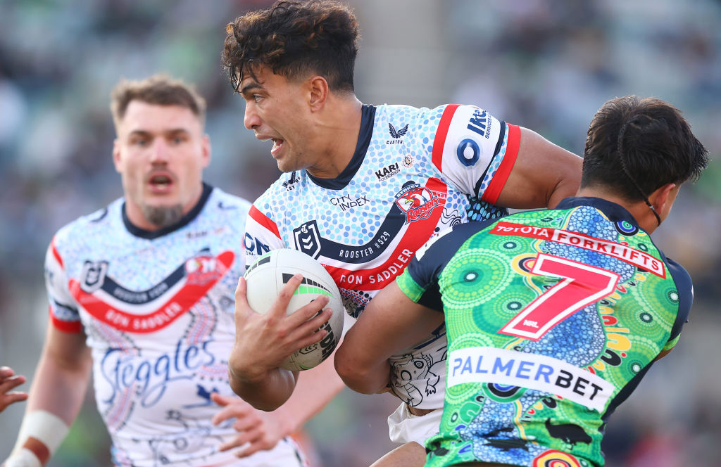 Joseph-Aukuso Su'ali'i is tackled by  Raiders' halfback Kaeo Weekes.