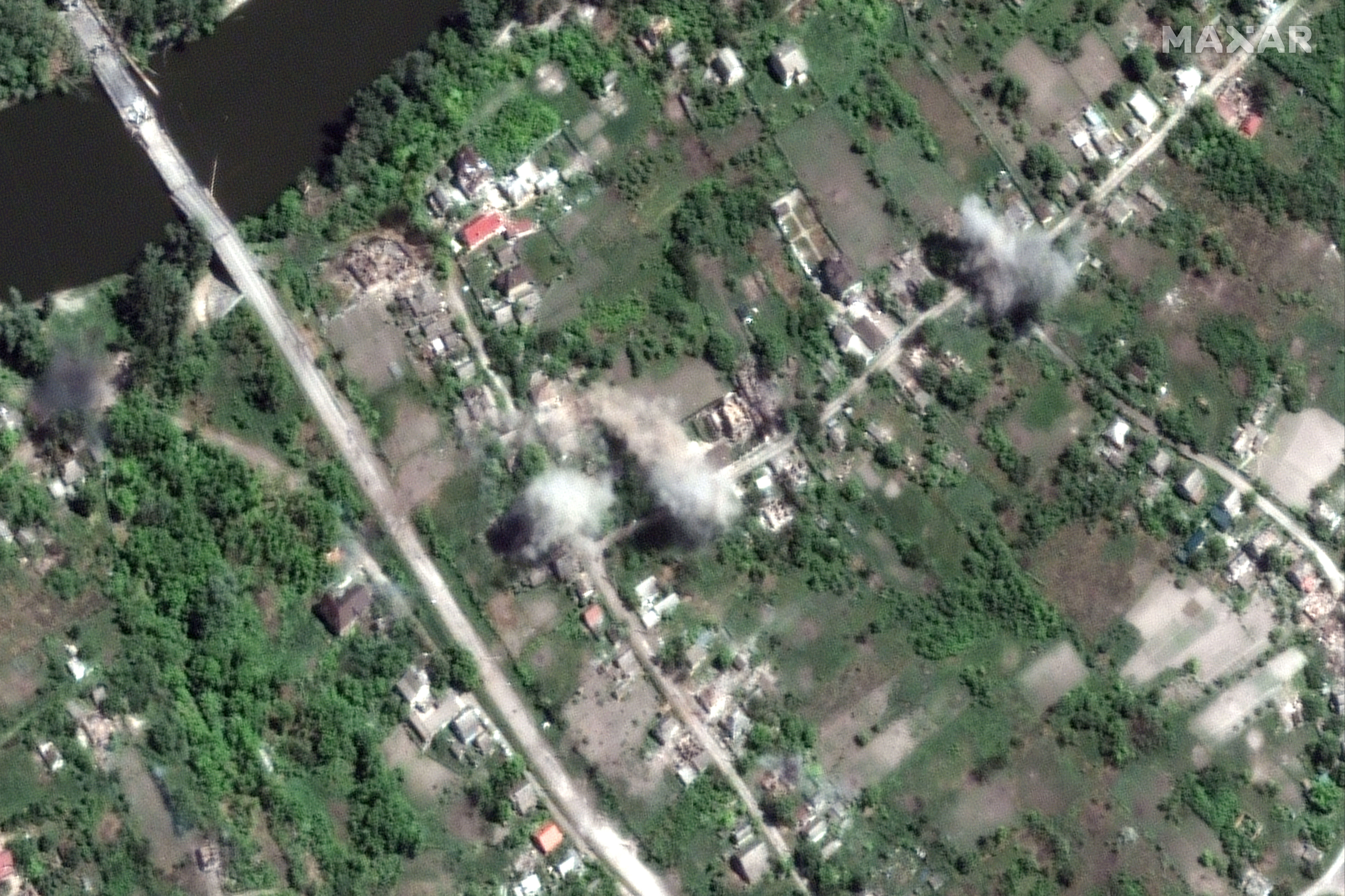 This satellite image provided by Maxar Technologies shows active artillery shelling in the town of Bogorodichne, Ukraine, northwest of Slovyansk, on Monday, June 6, 2022. (Maxar Technologies via AP)