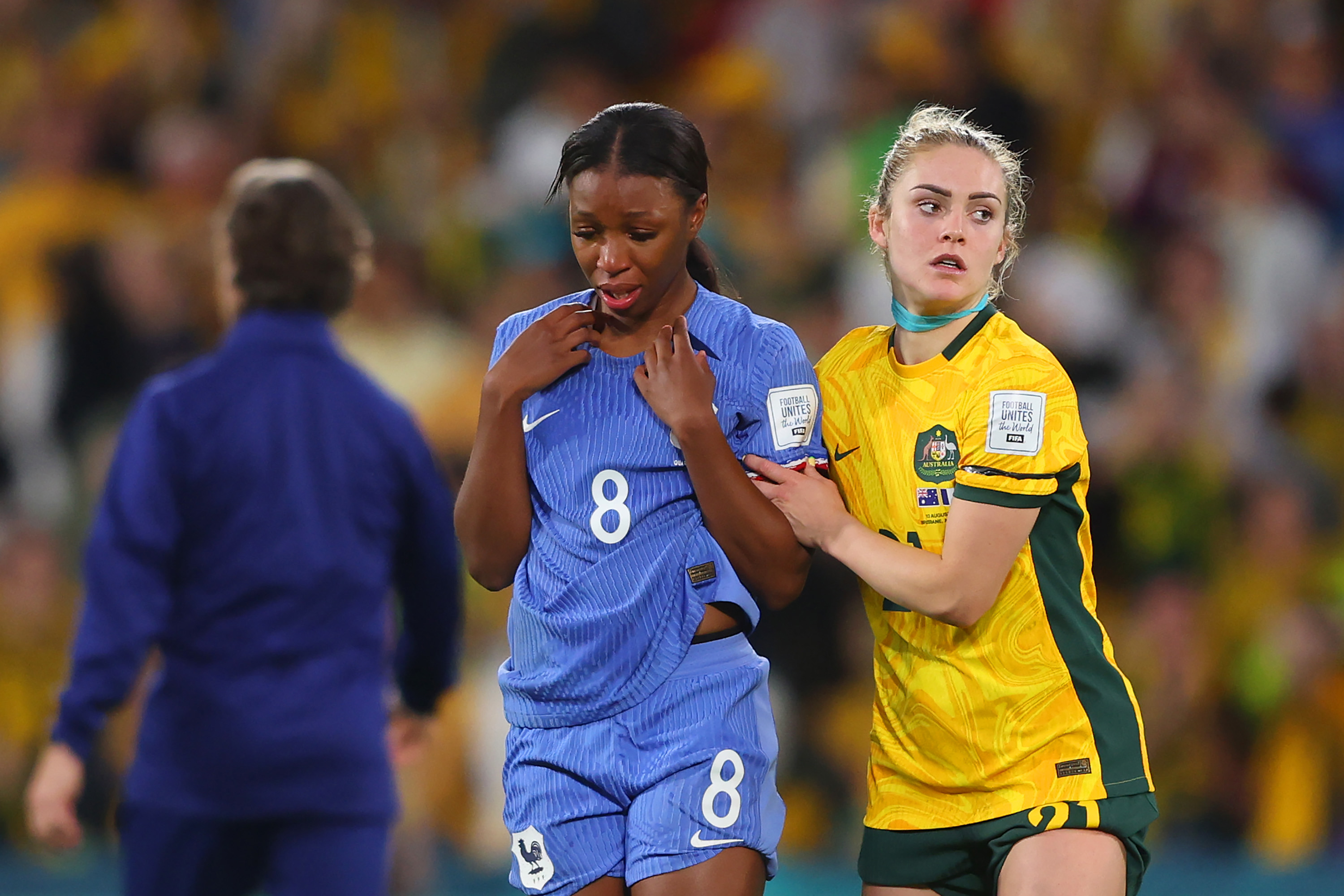 Grace Geyoro of France is consoled by Ellie Carpenter of Australia.