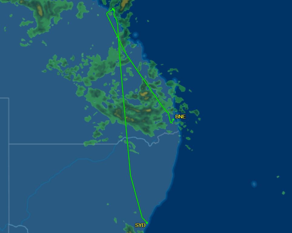 A Qantas flight approaching the runway on Hamilton Island in Queensland was forced to abort its landing due to wild weather.
