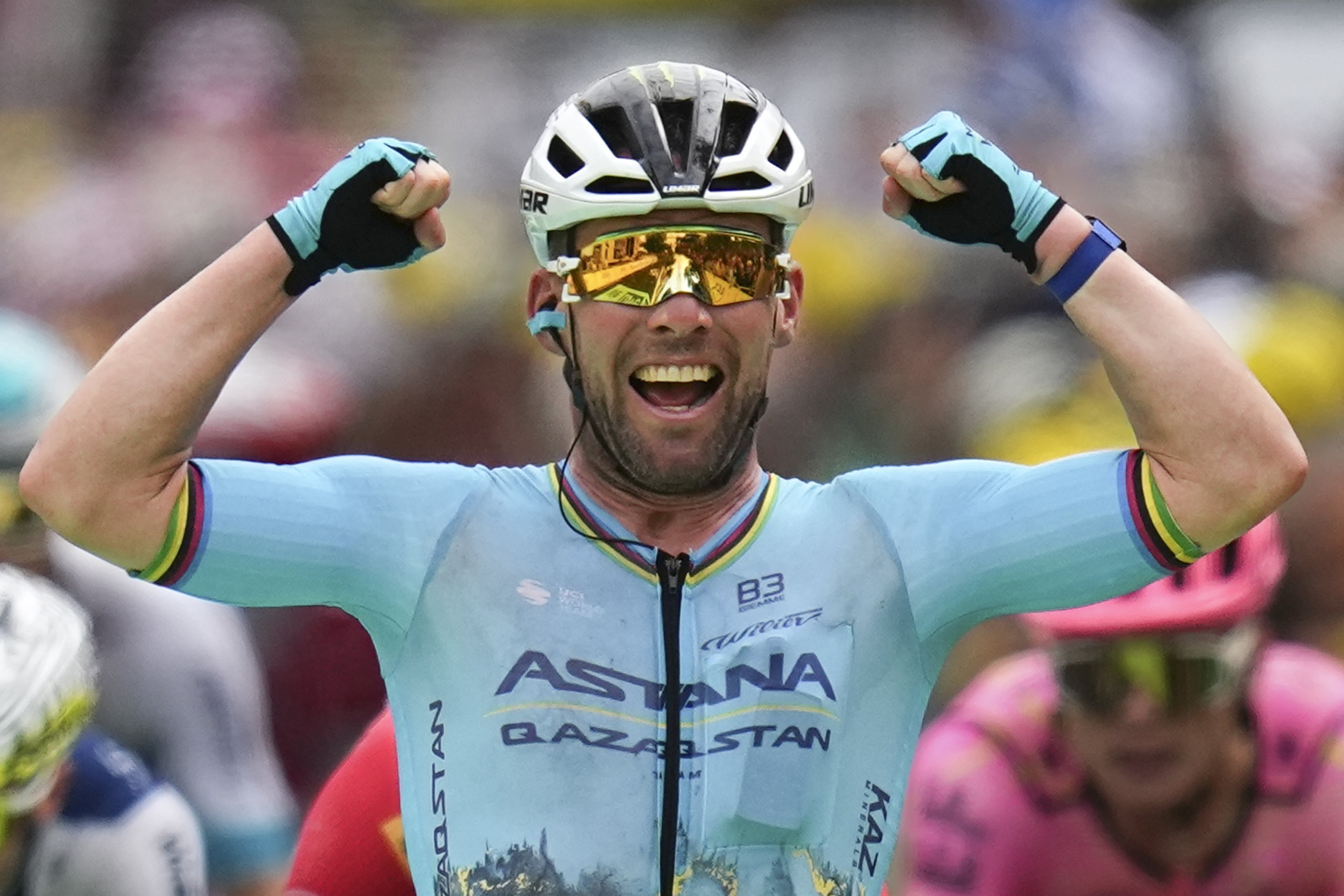 Britain's sprinter Mark Cavendish celebrates as he crosses the finish line to win a record 35th Tour de France stage.