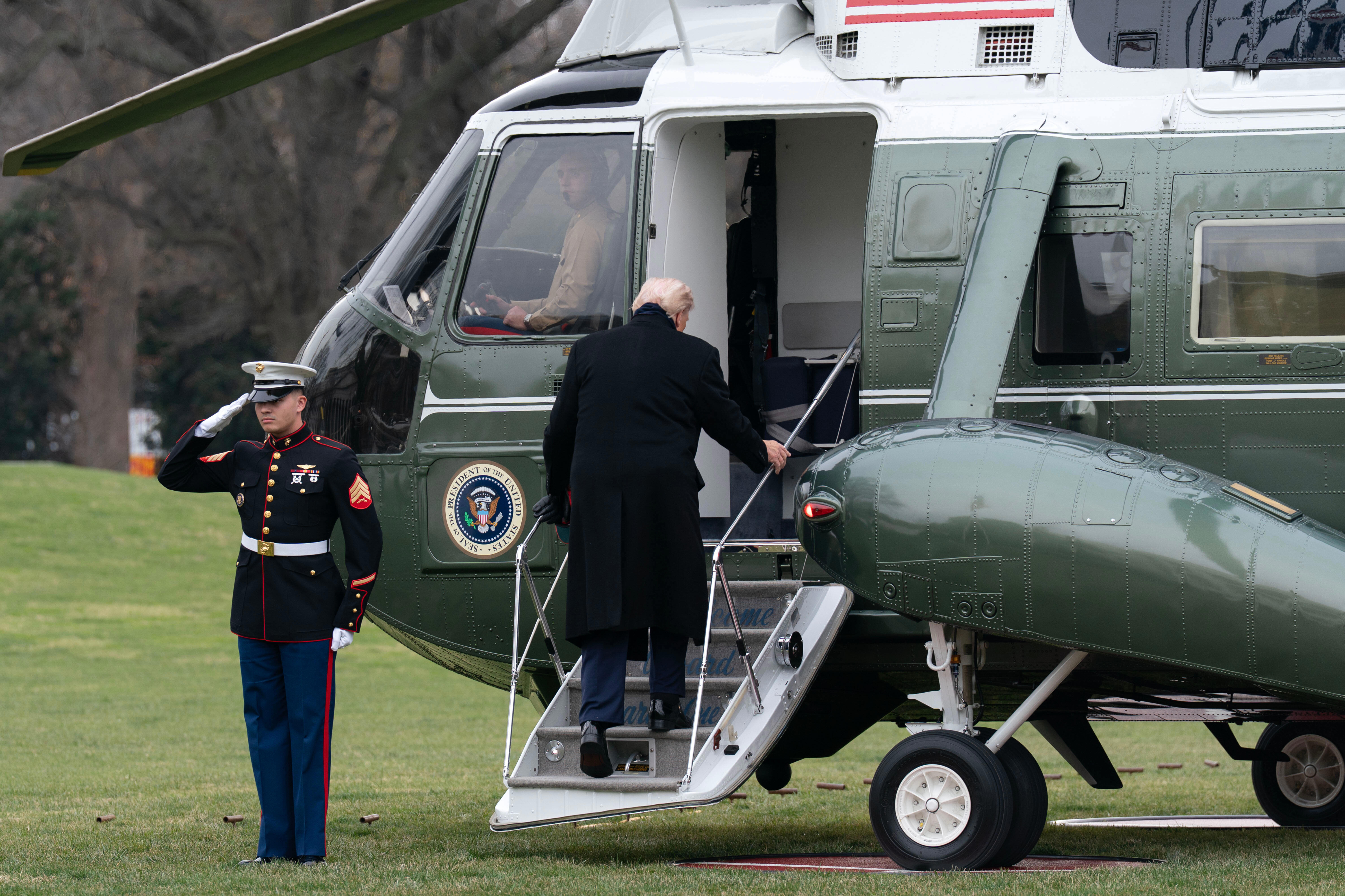 President Donald Trump boards Marine One as he departs from the South Lawn of the White House, Saturday, Dec. 13, 2025, in Washington, en route to Baltimore to attend the Army-Navy football game. (AP Photo/Jose Luis Magana)