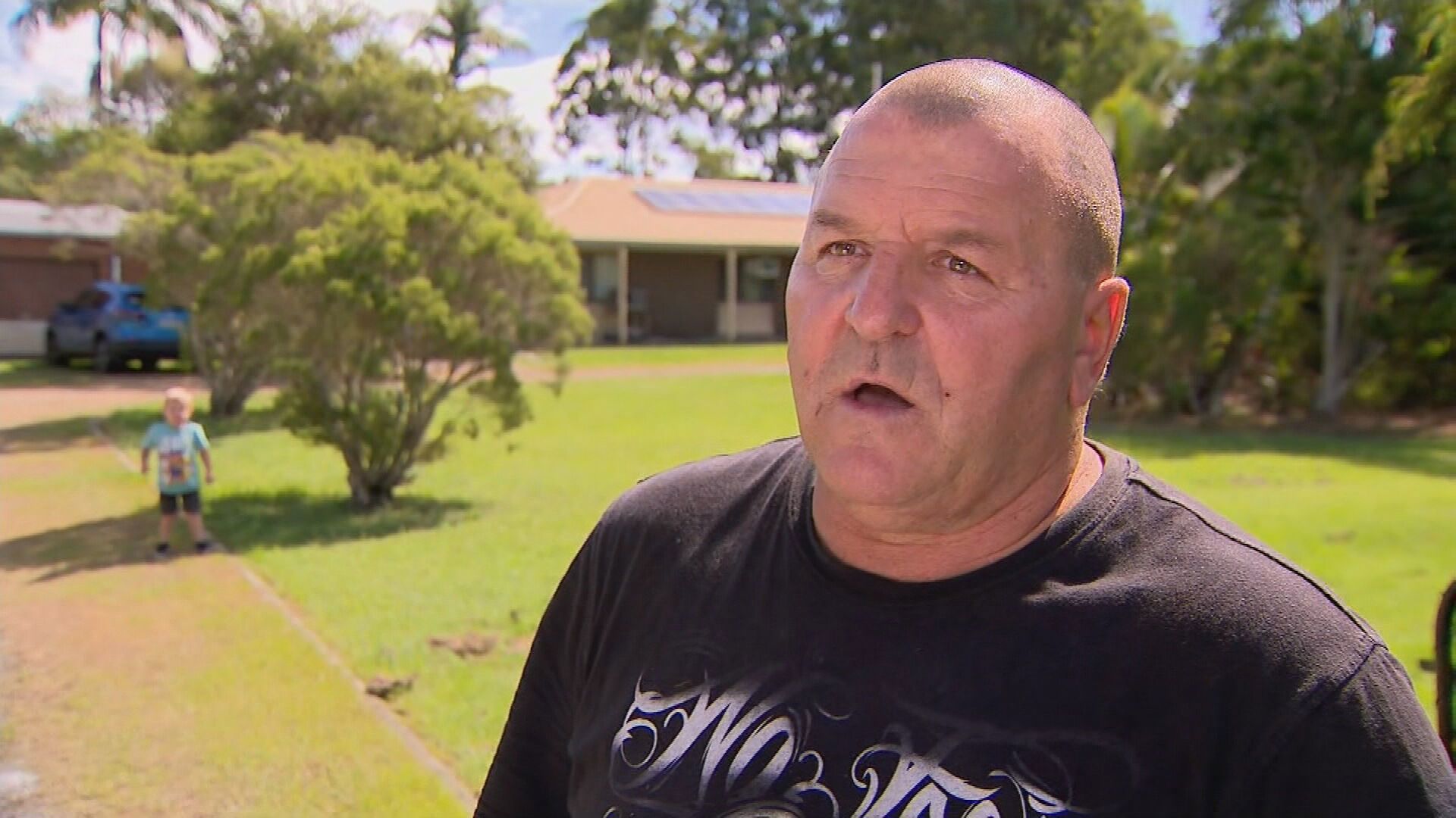 Neighbour Douglas Hutchings helped police put the injured woman into an ambulance. Burpengary East