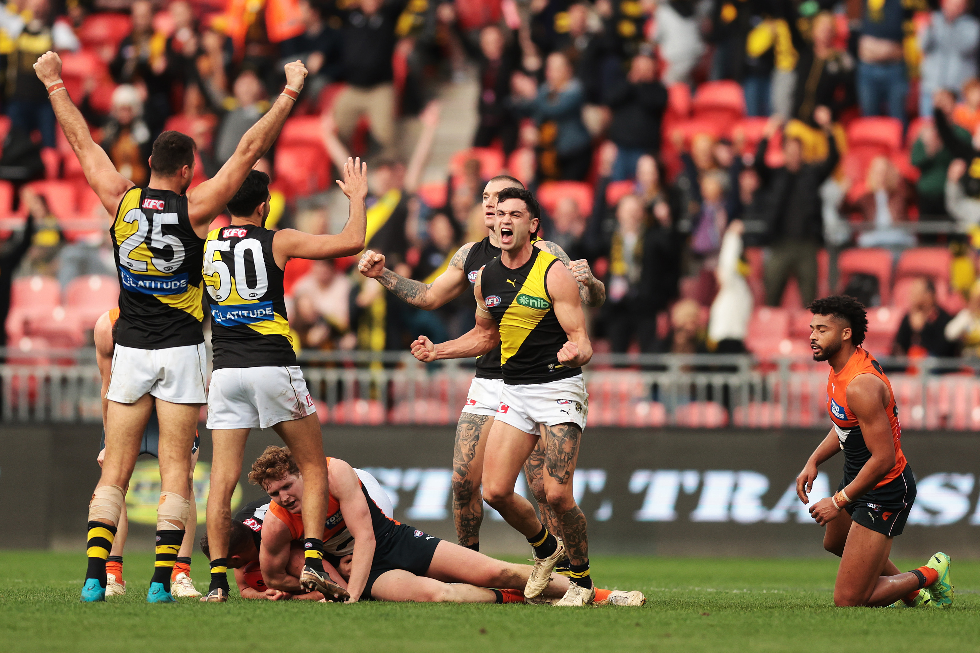 SYDNEY, AUSTRALIA - JUNE 04:  Tim Taranto of the Tigers  celebrates victory on the final siren during the round 12 AFL match between Greater Western Sydney Giants and Richmond Tigers at GIANTS Stadium, on June 04, 2023, in Sydney, Australia. (Photo by Mark Metcalfe/AFL Photos/via Getty Images )