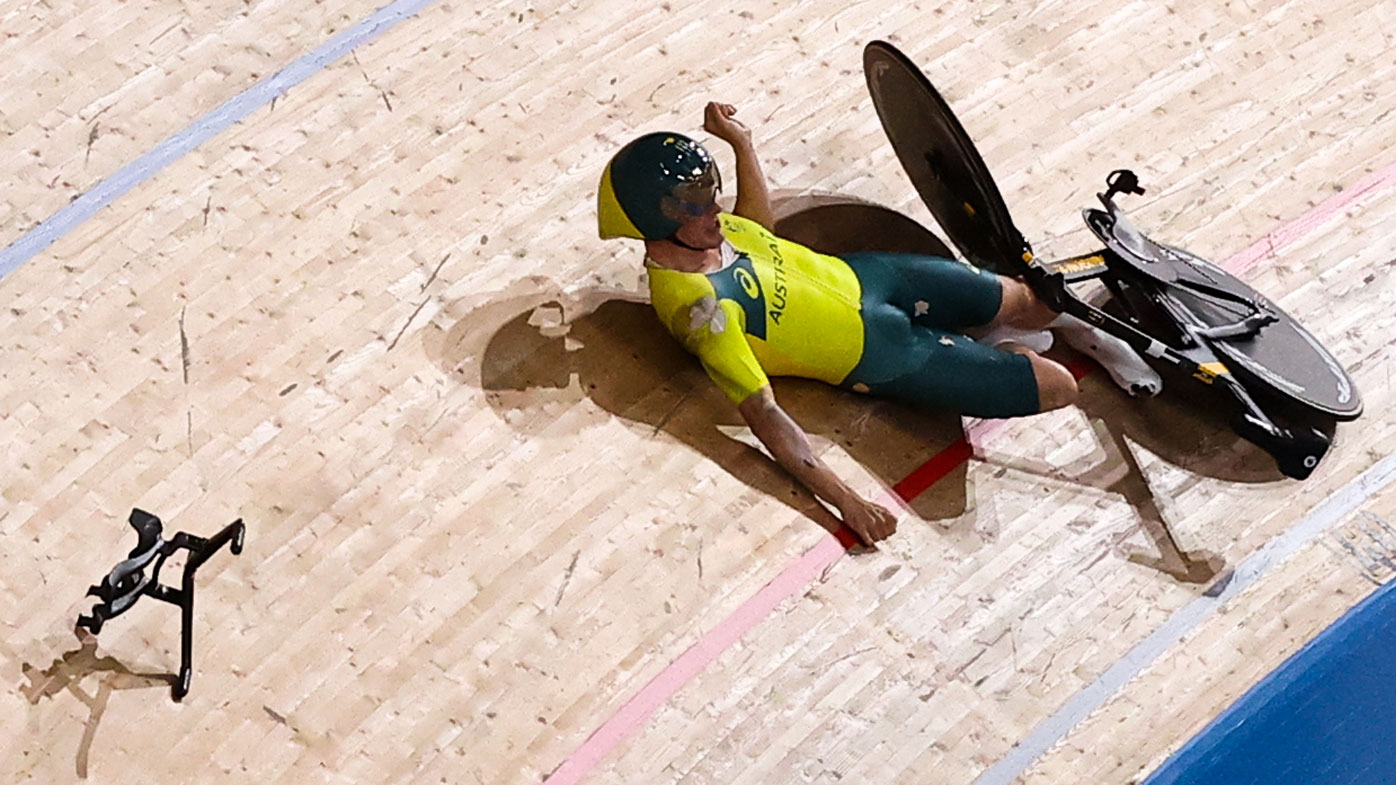 Alexander Porter falls during the men's team pursuit qualifying cycling track event.