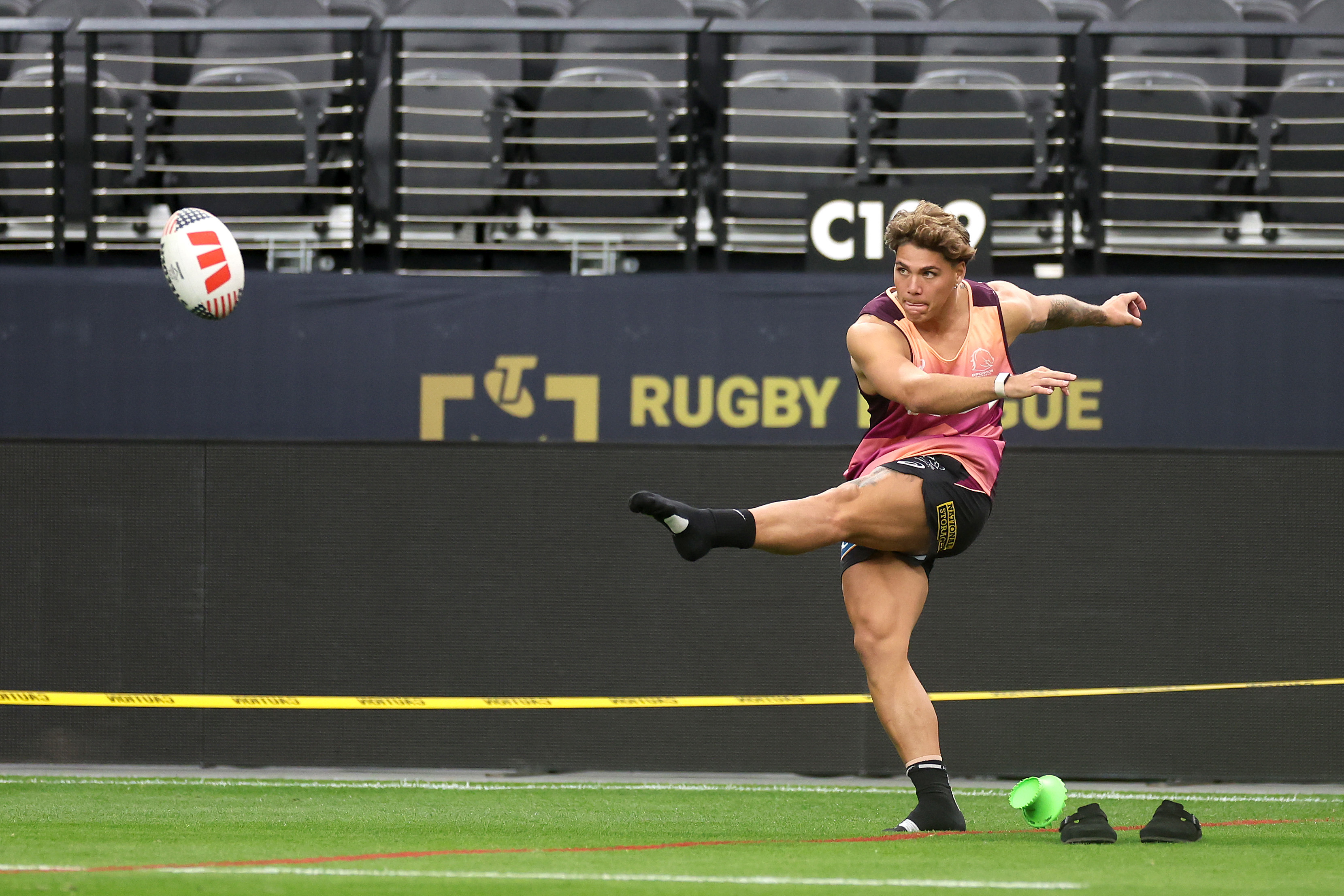 Reece Walsh does a practice kick at Allegiant Stadium ahead of the Broncos' season-opener against the Roosters.