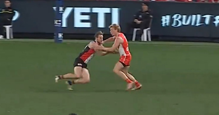 Isaac Heeney whacks Jimmy Webster off the ball.