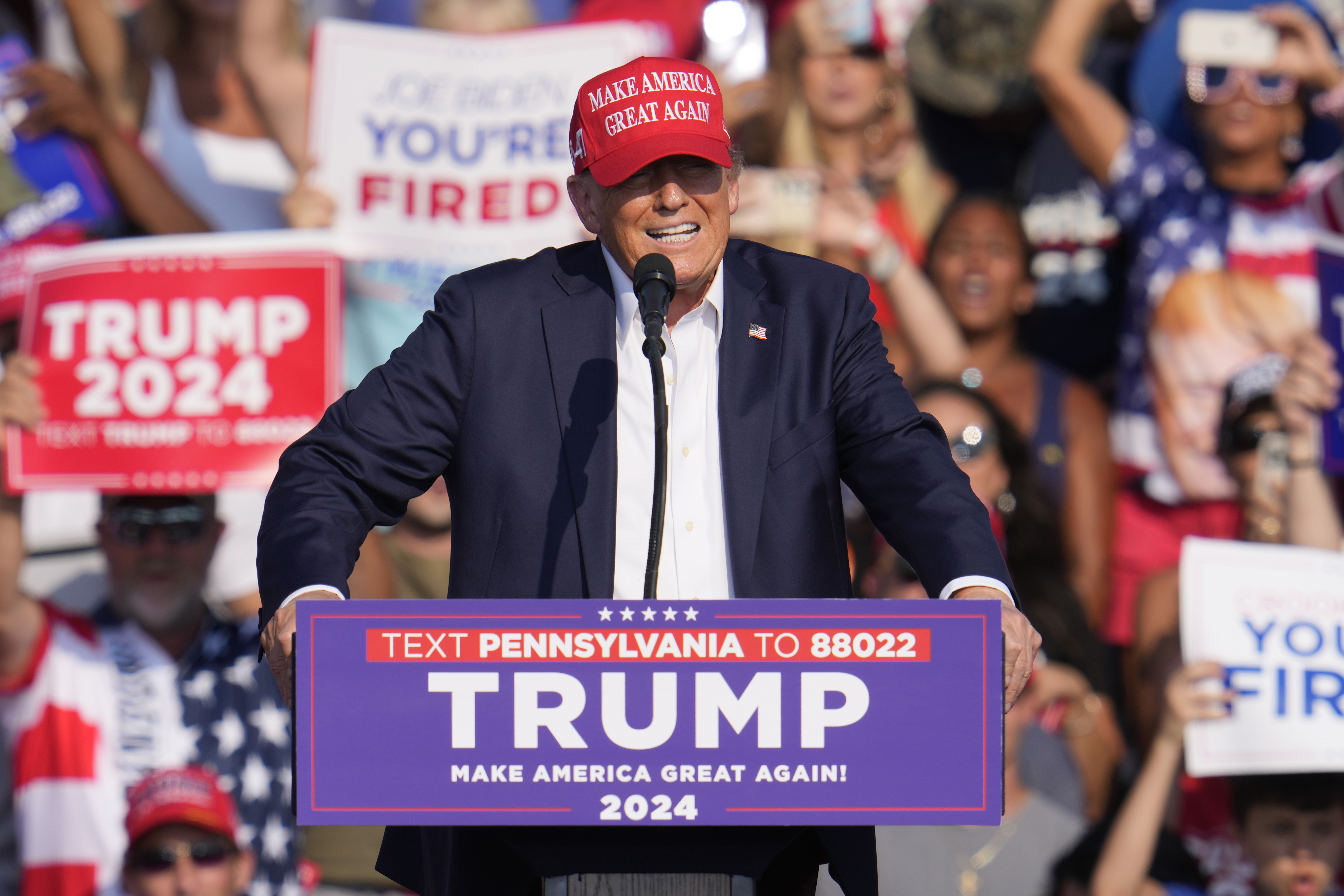 Donald Trump speaking at his Pennsylvania rally, moments before shots were fired at him from a nearby rooftop.