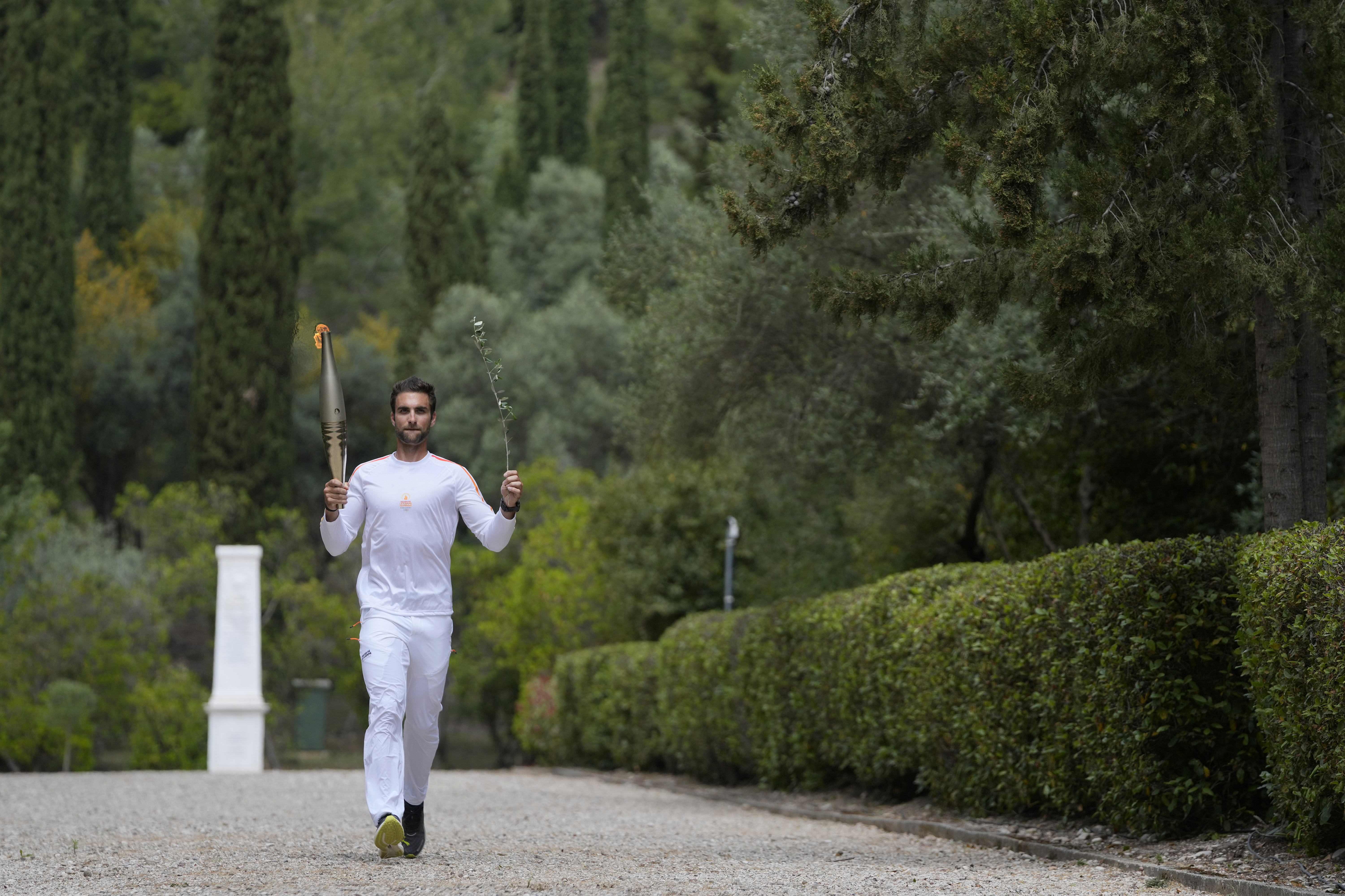 The first torch bearer, Greek olympic gold medalist Stefanos Douskos