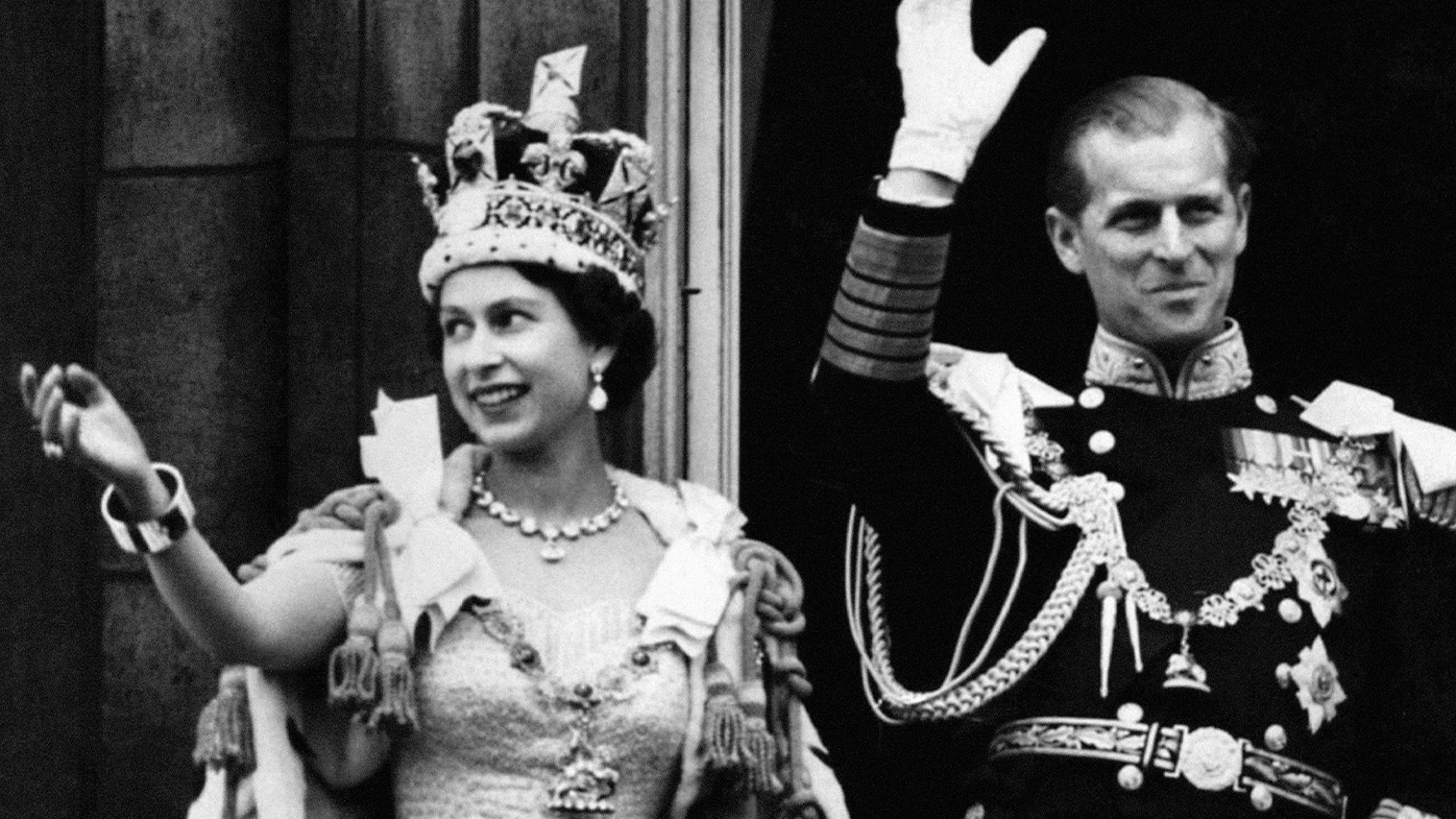 Queen Elizabeth II and Prince Philip wave to the crowd after her Coronation