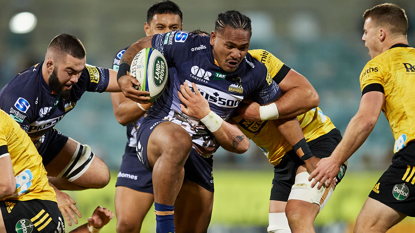 Solomone Kata of the Brumbies is tackled during the round four Super Rugby Trans-Tasman match between the ACT Brumbies and the Hurricanes at GIO Stadium on June 05, 2021 in Canberra, Australia. (Photo by Brett Hemmings/Getty Images)