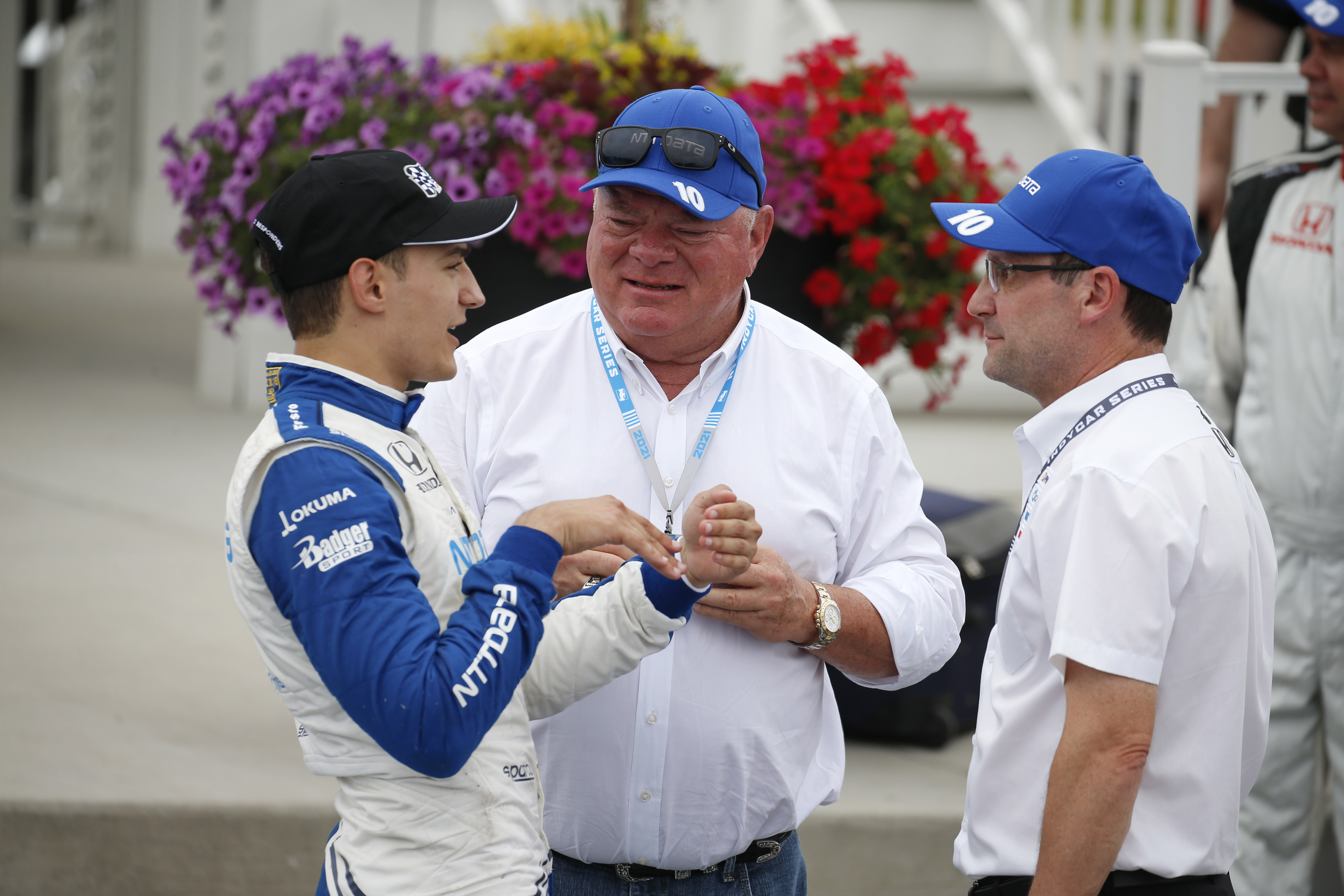 Alex Palou talks with owner Chip Ganassi after winning the REV Group Grand Prix.