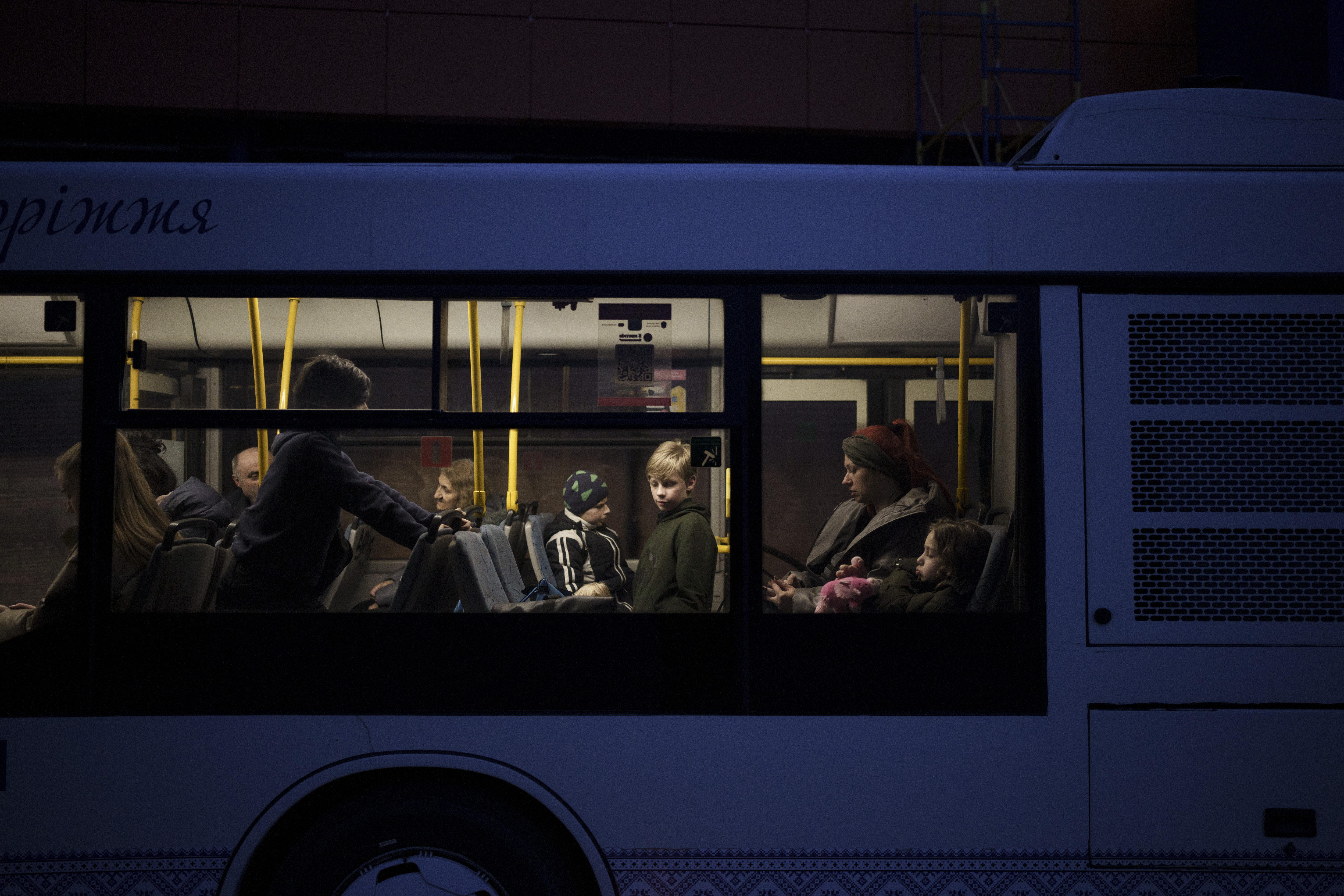 A bus carries internally displaced people from Mariupol and Berdiansk to a refugee center in Zaporizhia, Ukraine, Friday, April 1, 2022. (AP Photo/Felipe Dana)