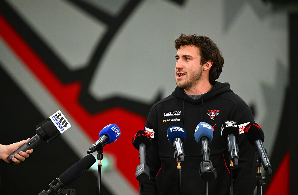 Andrew McGrath speaks to reporters about the sacking. 
