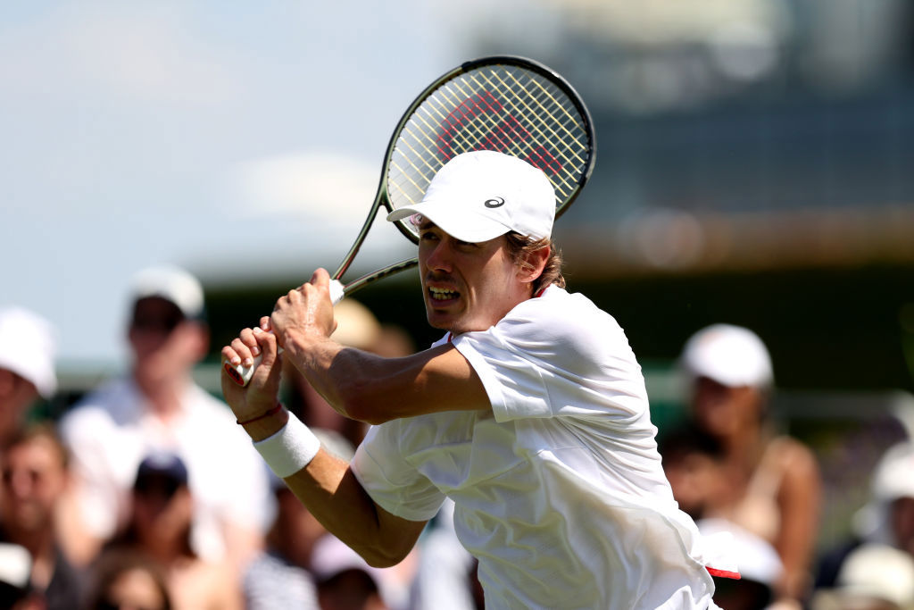 Alex De Minaur plays a backhand against Matteo Berrettini.