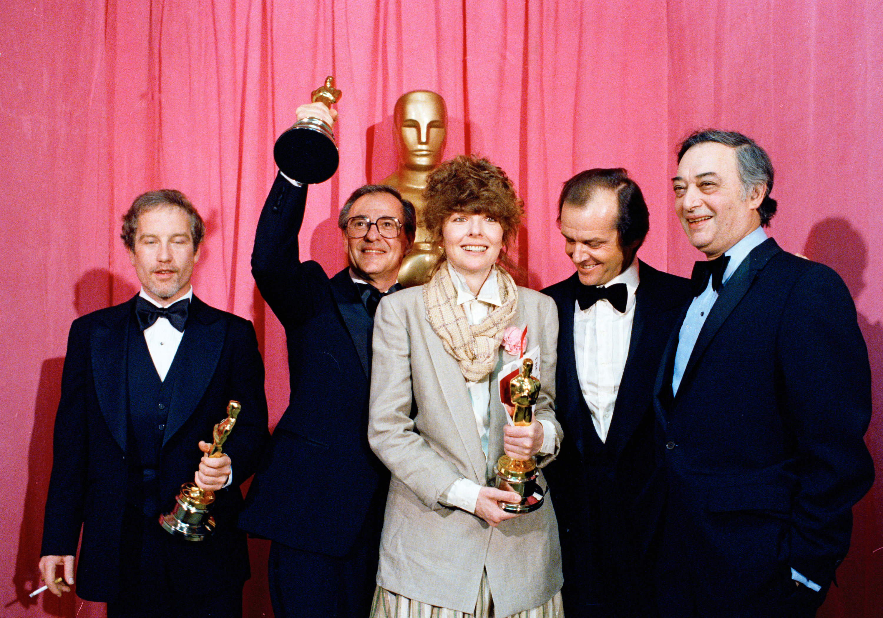 FILE - Oscar winners pose with their statuettes at the Academy Awards presentation in Los Angeles, April 3, 1978, from left: Richard Dreyfuss, best actor for "The Goodbye Girl"; Charles H. Joffe, best picture for "Annie Hall"; Diane Keaton, best actress for "Annie Hall"; presenter Jack Nicholson, and producer Jack Rollins of United Artists. (AP Photo, File)