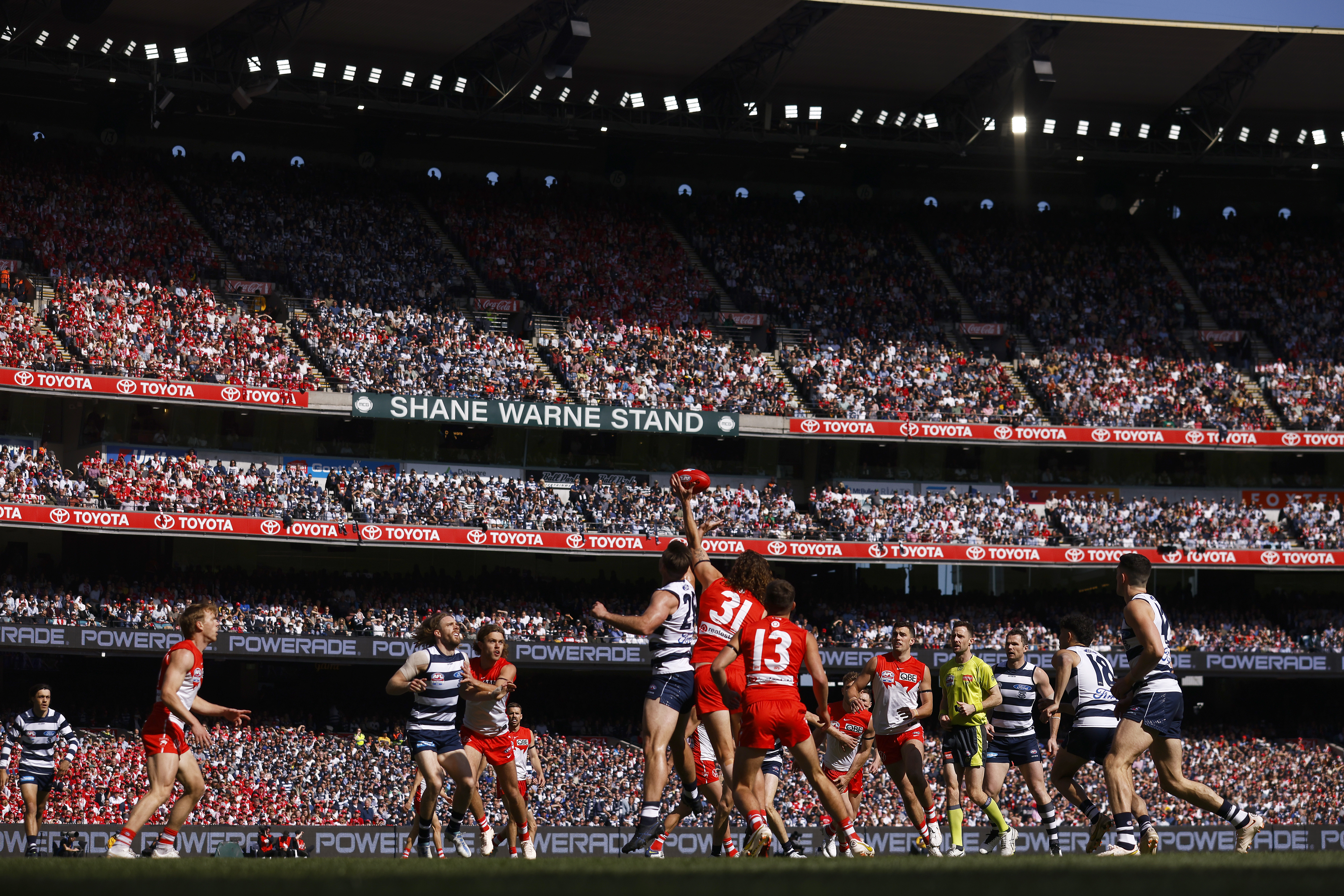 Tom Hawkins of the Cats and Tom Hickey of the Swans contest the ruck during the 2022 AFL Grand Final match between the Geelong Cats and the Sydney Swans at the Melbourne Cricket Ground on September 24, 2022 in Melbourne, Australia. (Photo by Daniel Pockett/AFL Photos/via Getty Images)