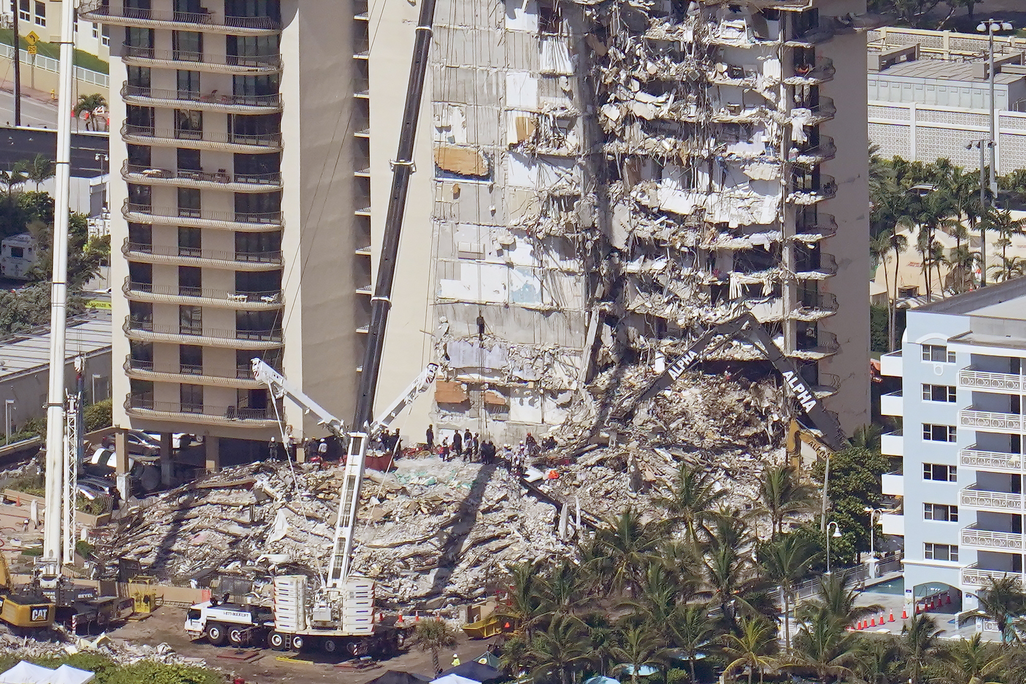 The pancake collapse of the building has frustrated efforts to reach anyone who may have survived in a pocket of space.