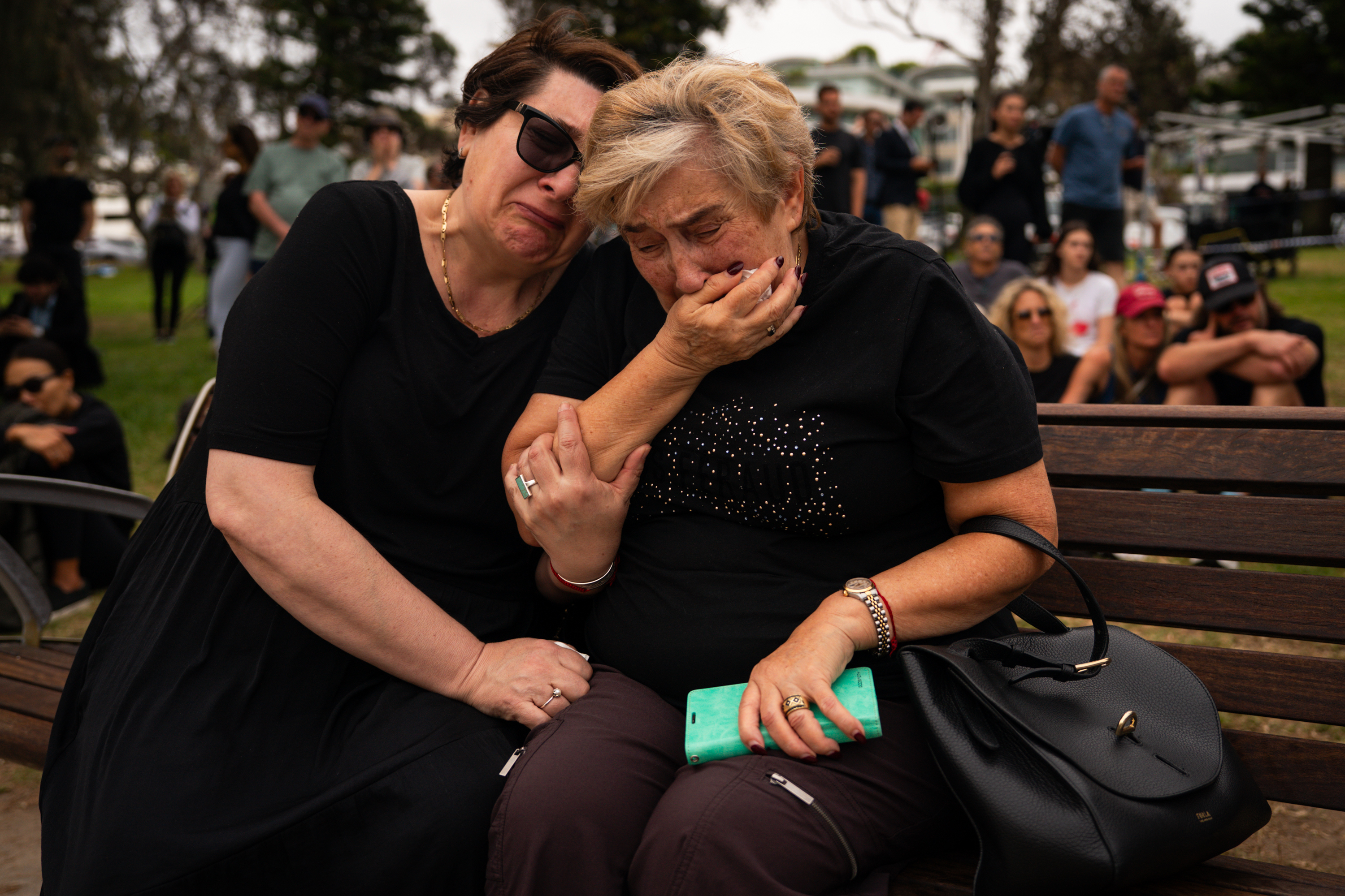 Mother and daughter, Jana and Ella embrace while gathering at Bondi Pavilion, two days after a mass shooting at Bondi Beach, on December 16, 2025 in Sydney, Australia.