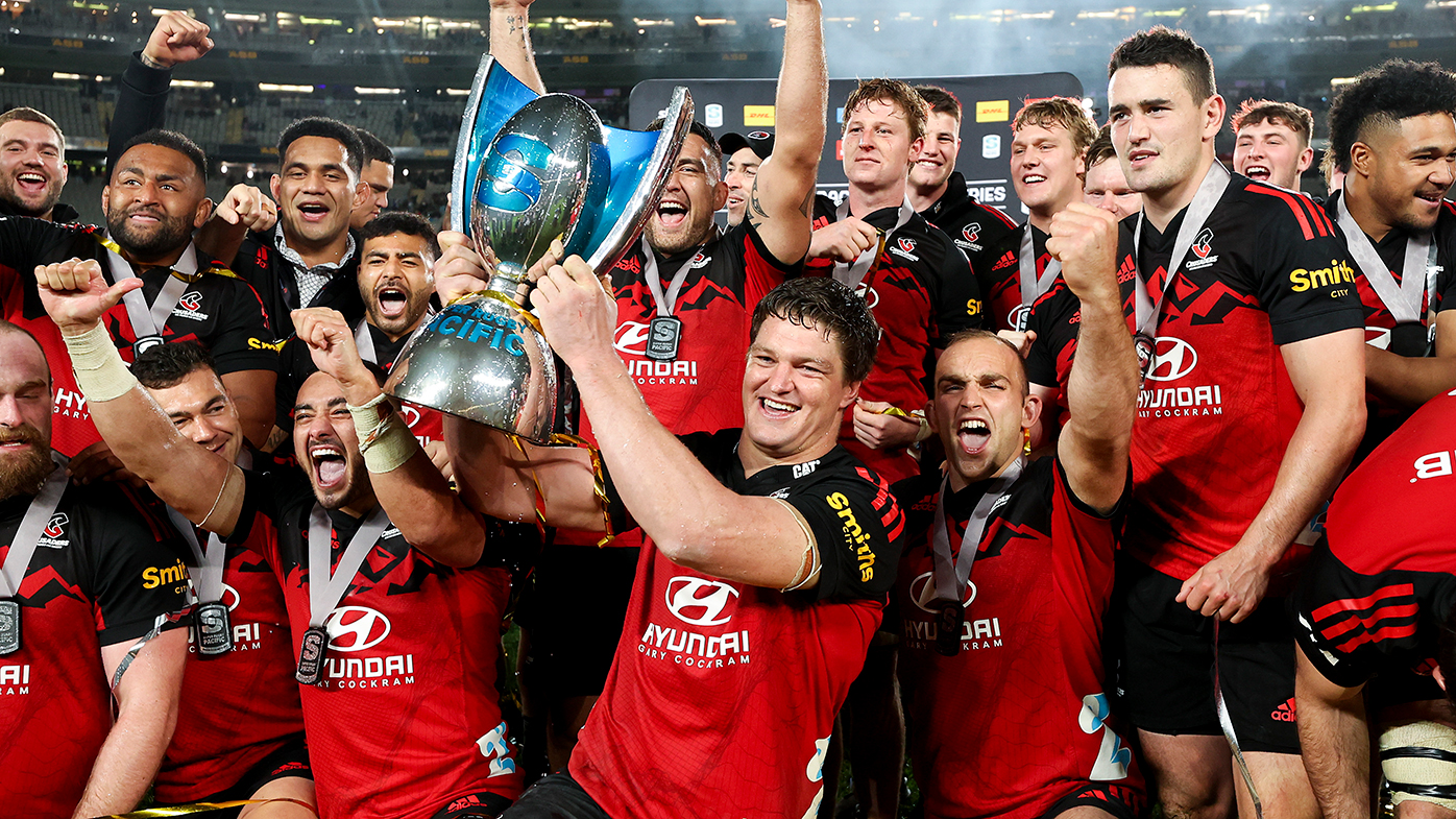 Scott Barrett of the Crusaders holds the Super Rugby Pacific trophy after winning the 2022 Super Rugby Pacific Final match between the Blues and the Crusaders.