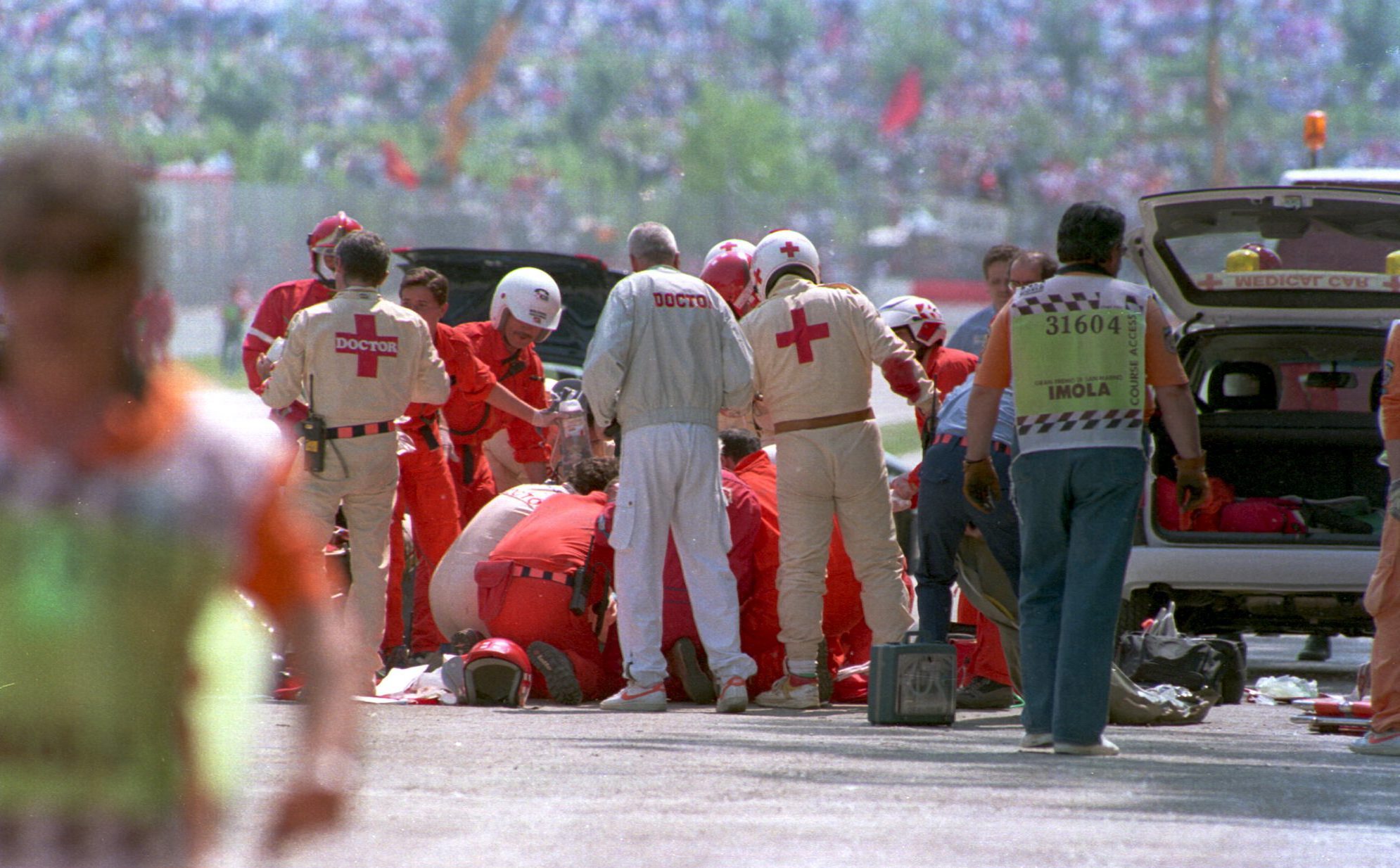 Ayrton Senna being attended to by medics after his crash while leading the 1994 San Marino Grand Prix. Mandatory Credit: Anton Want/ALLSPORT